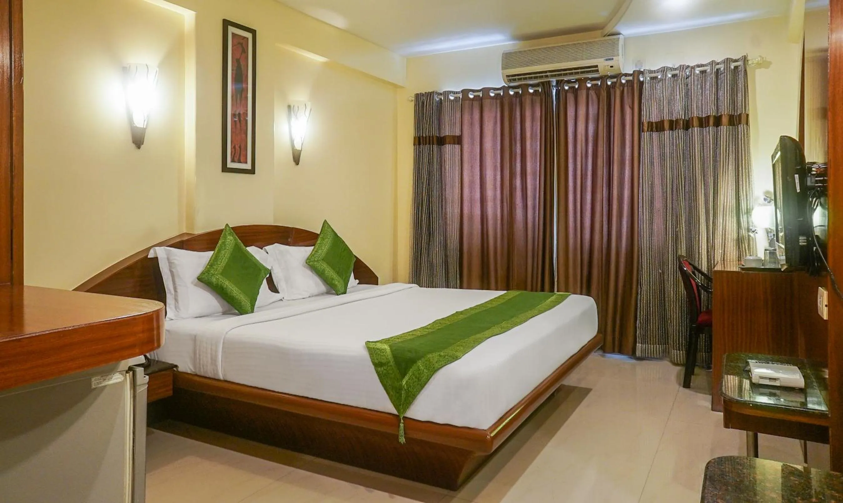 Bed in Treebo Brahma Regency