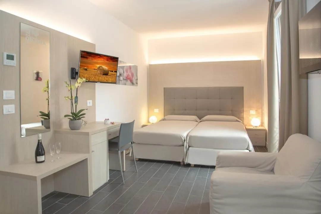 Bed in Hotel Orchidea