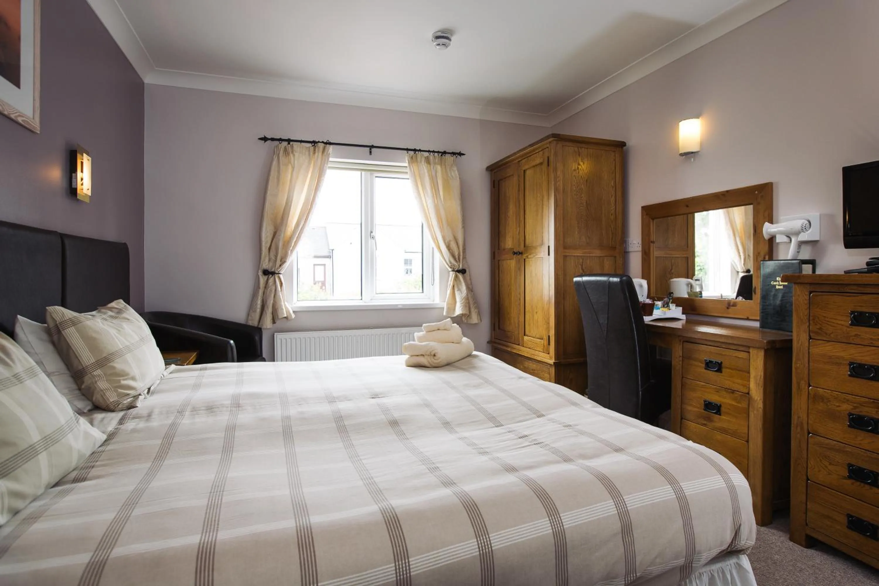 Bed in The Coach House Hotel