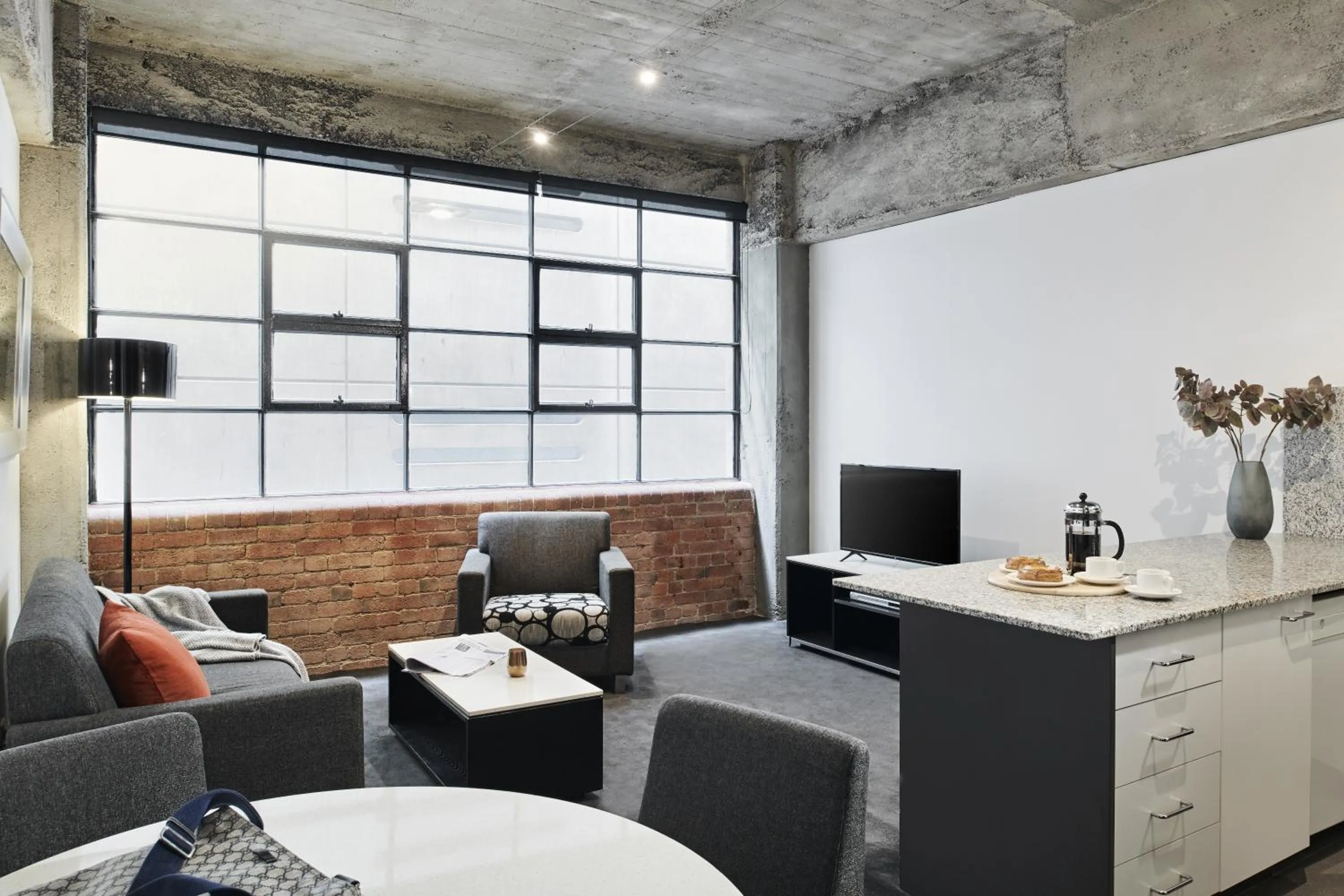 Living room in Punthill Apartment Hotel - Manhattan