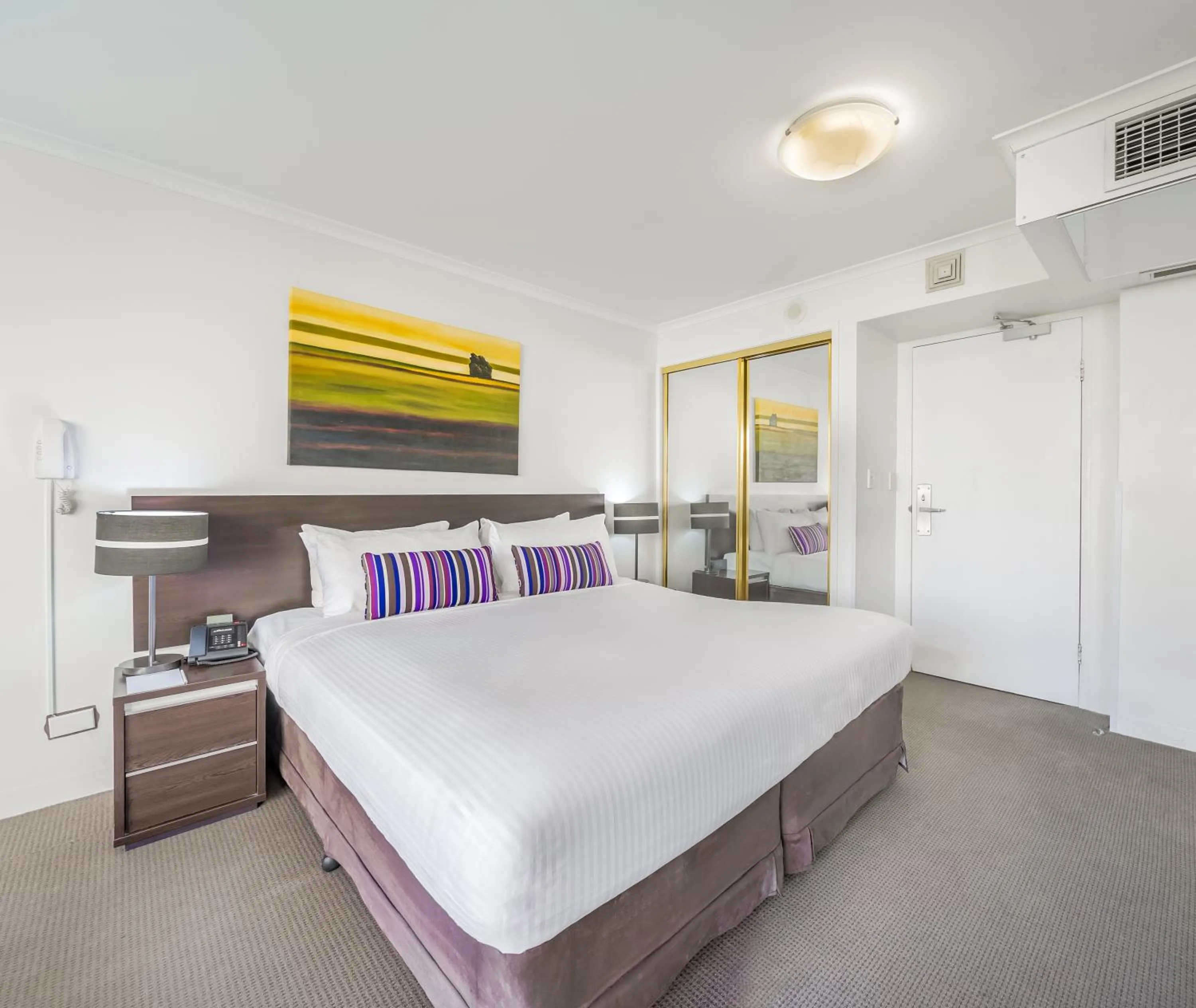 Bed in Oaks Sydney Hyde Park Suites