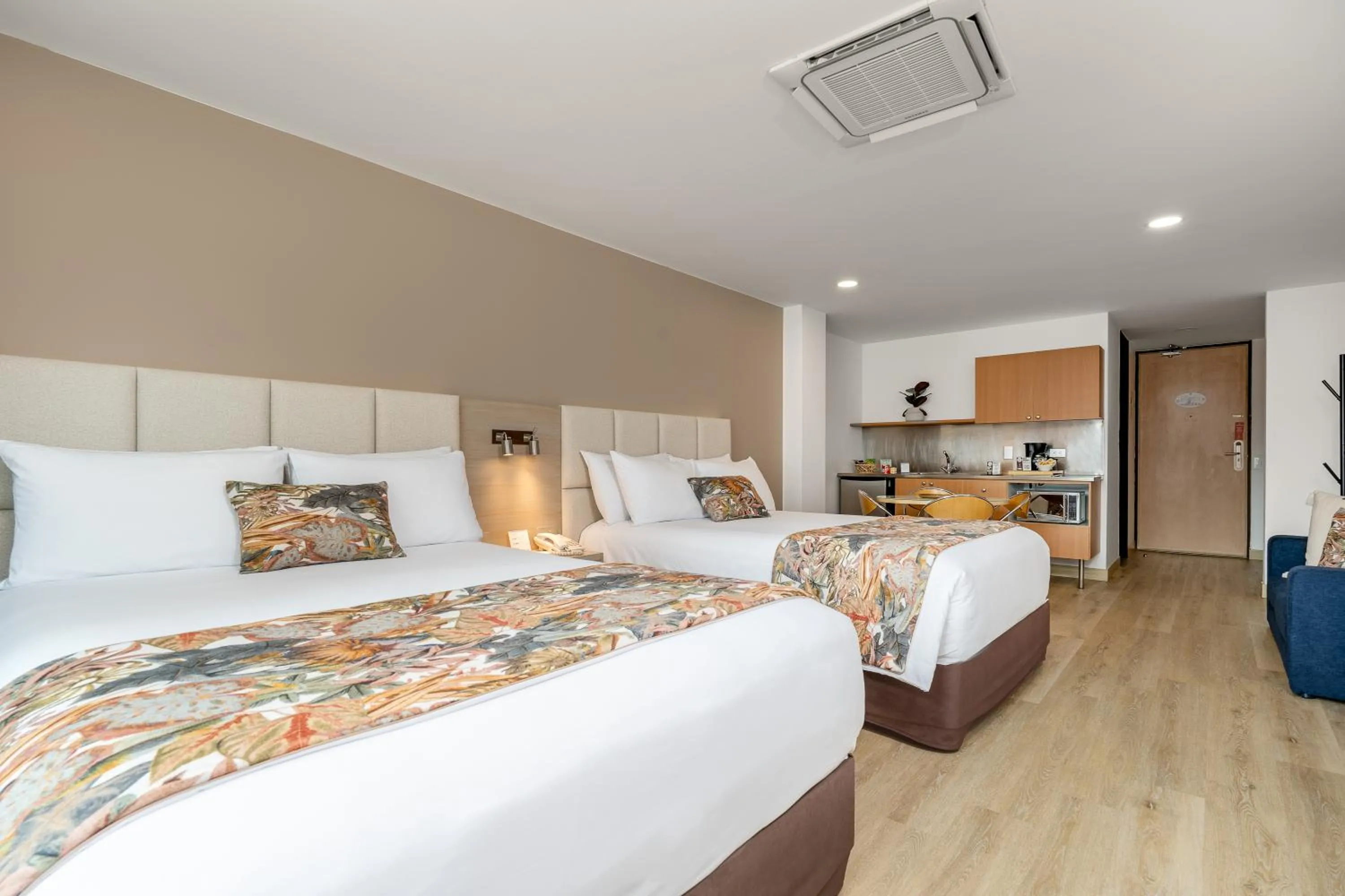 Bed in Novelty Suites Hotel - Oviedo Mall