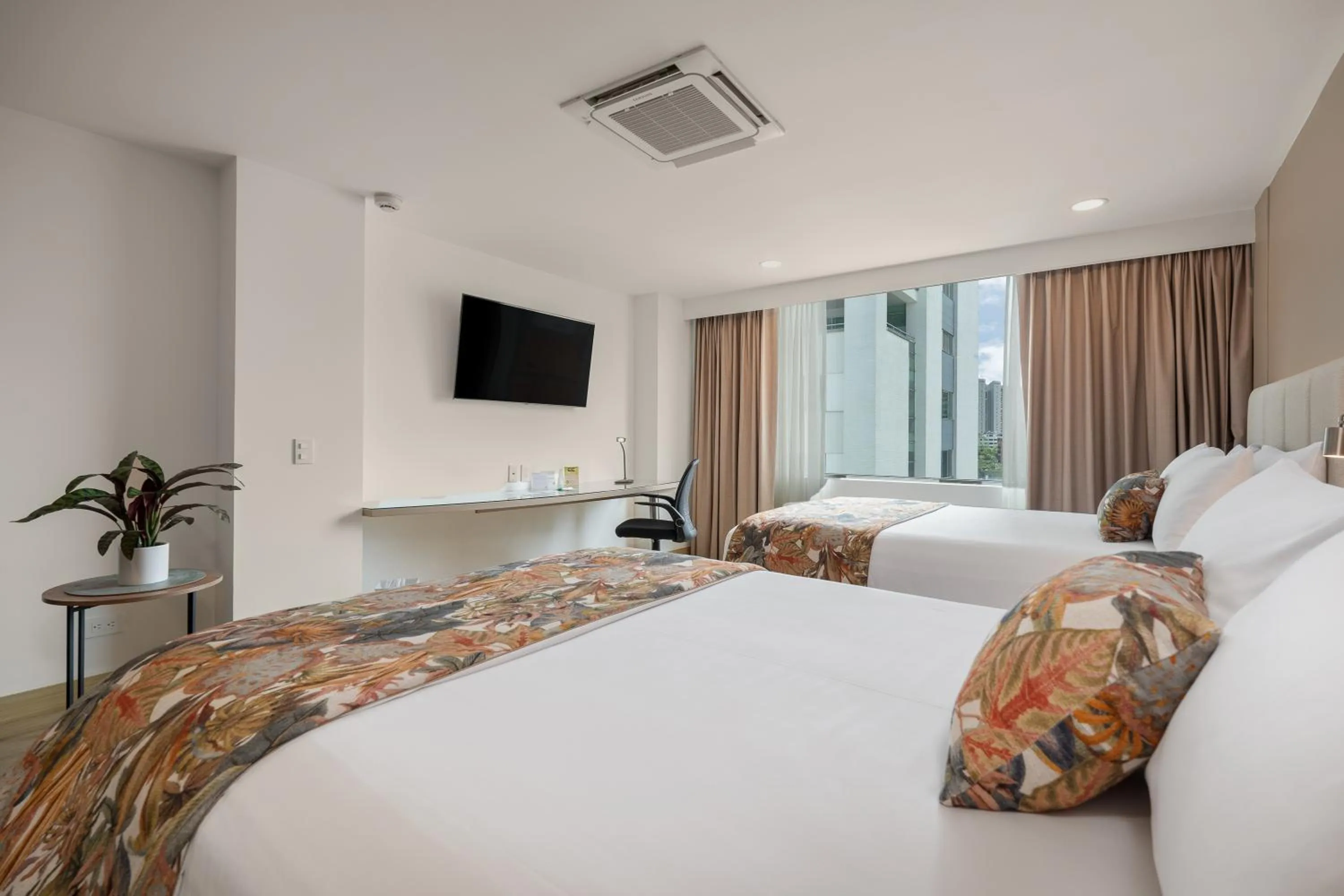 Bed in Novelty Suites Hotel - Oviedo Mall