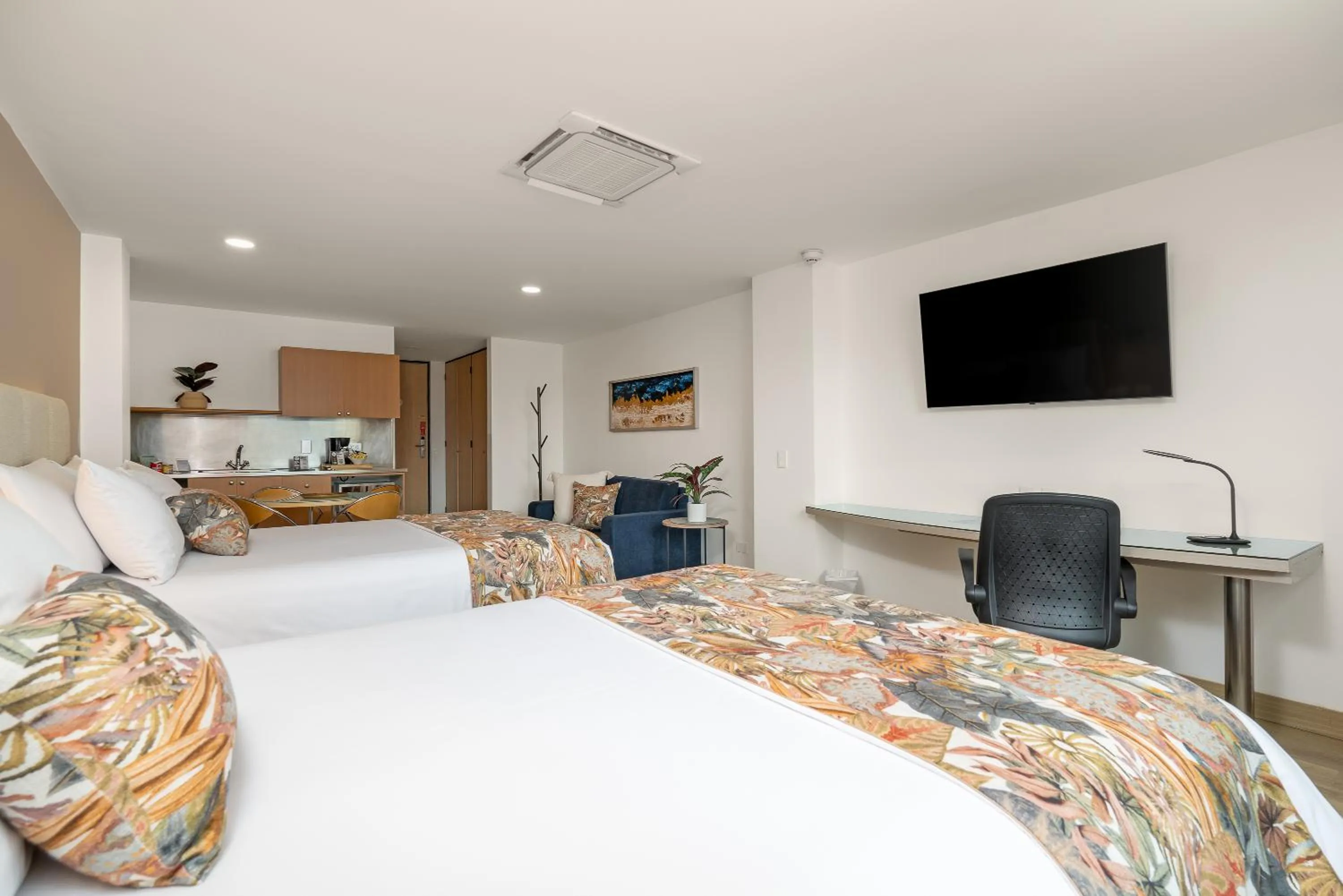 Bed in Novelty Suites Hotel - Oviedo Mall