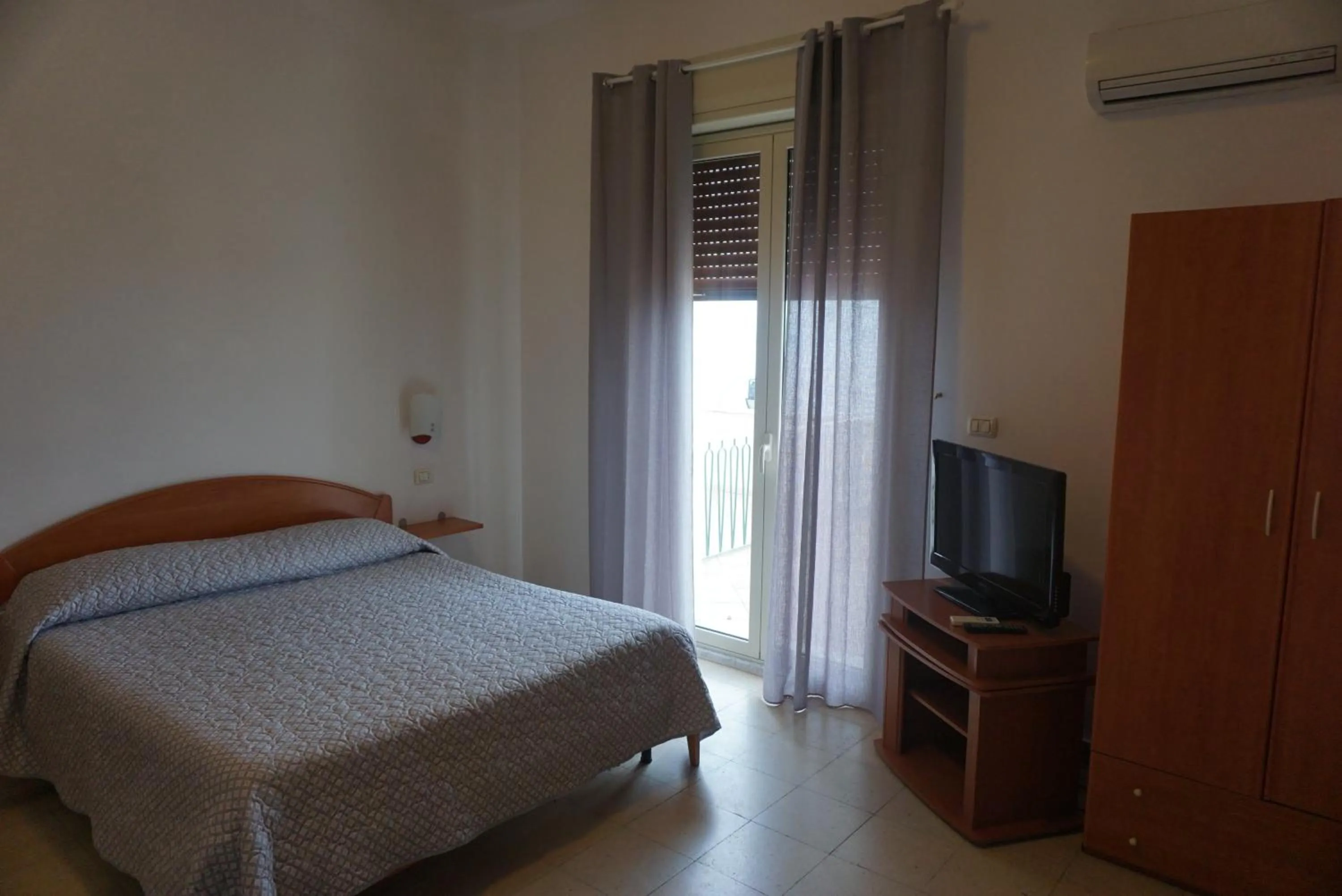 Bed in Hotel Villa Souvenir