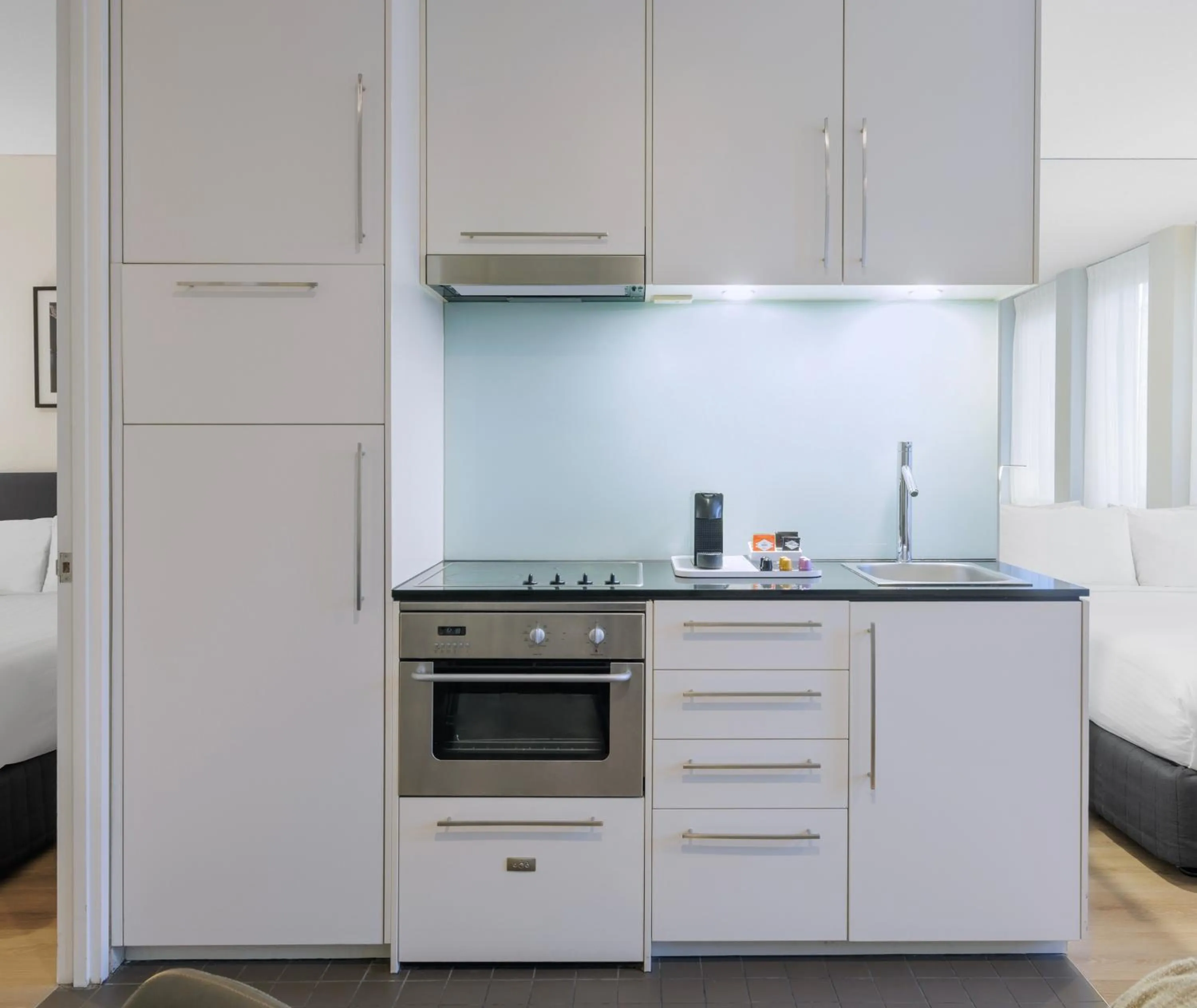 Kitchen or kitchenette in Oaks Melbourne on Collins Suites