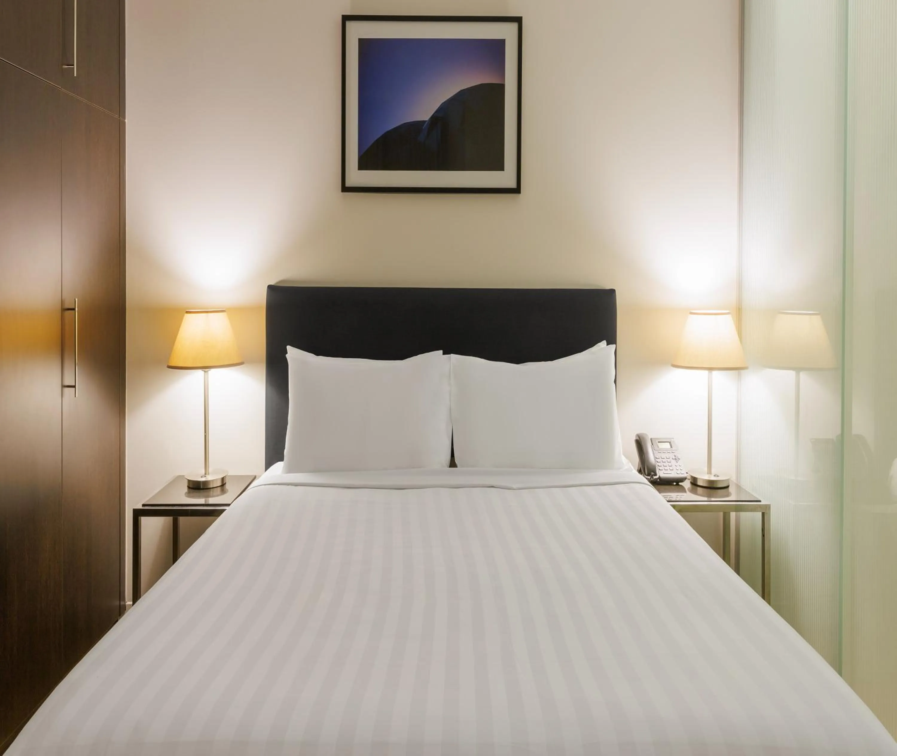 Bed in Oaks Melbourne on Collins Suites