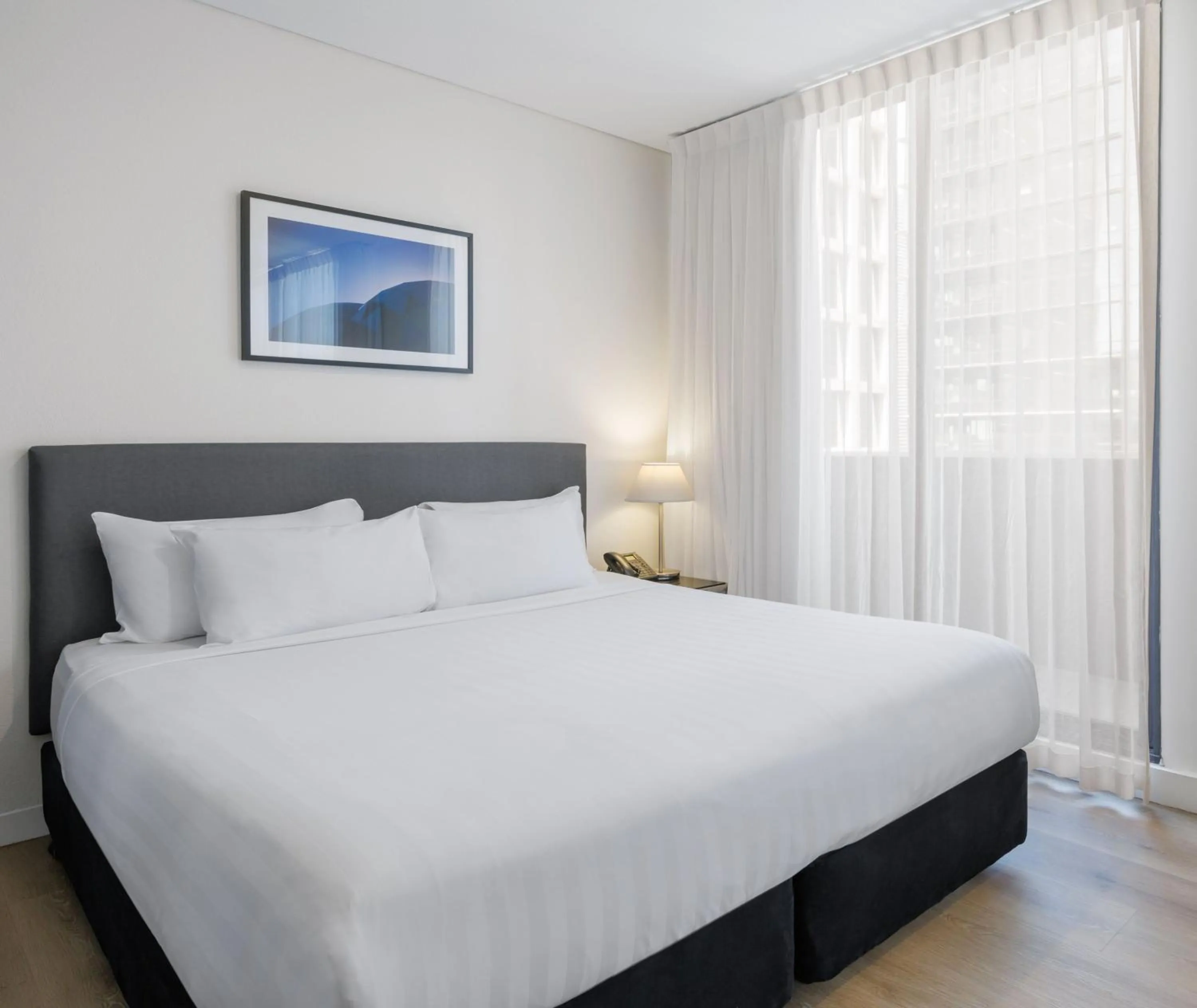 Bed in Oaks Melbourne on Collins Suites