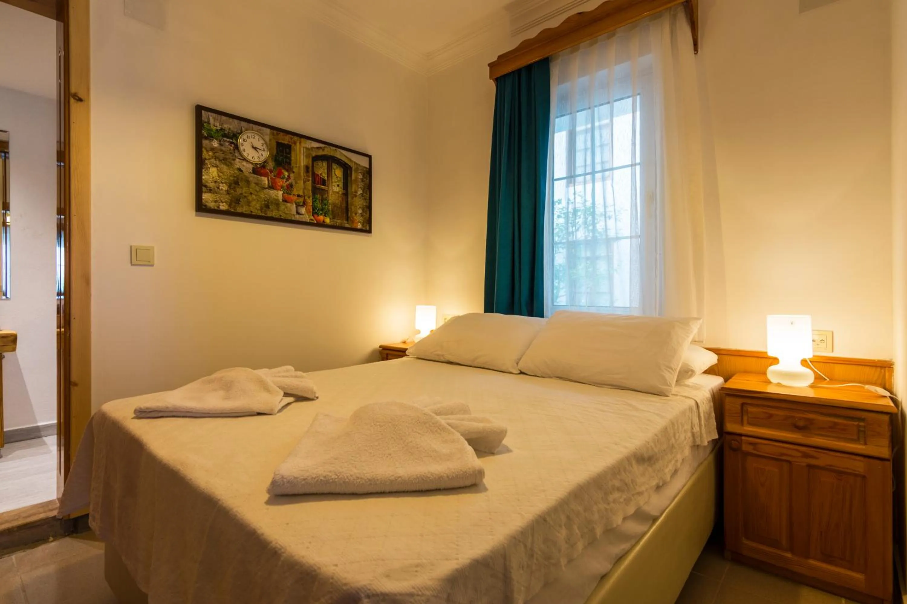 Bed in Calypso Cozy Suites