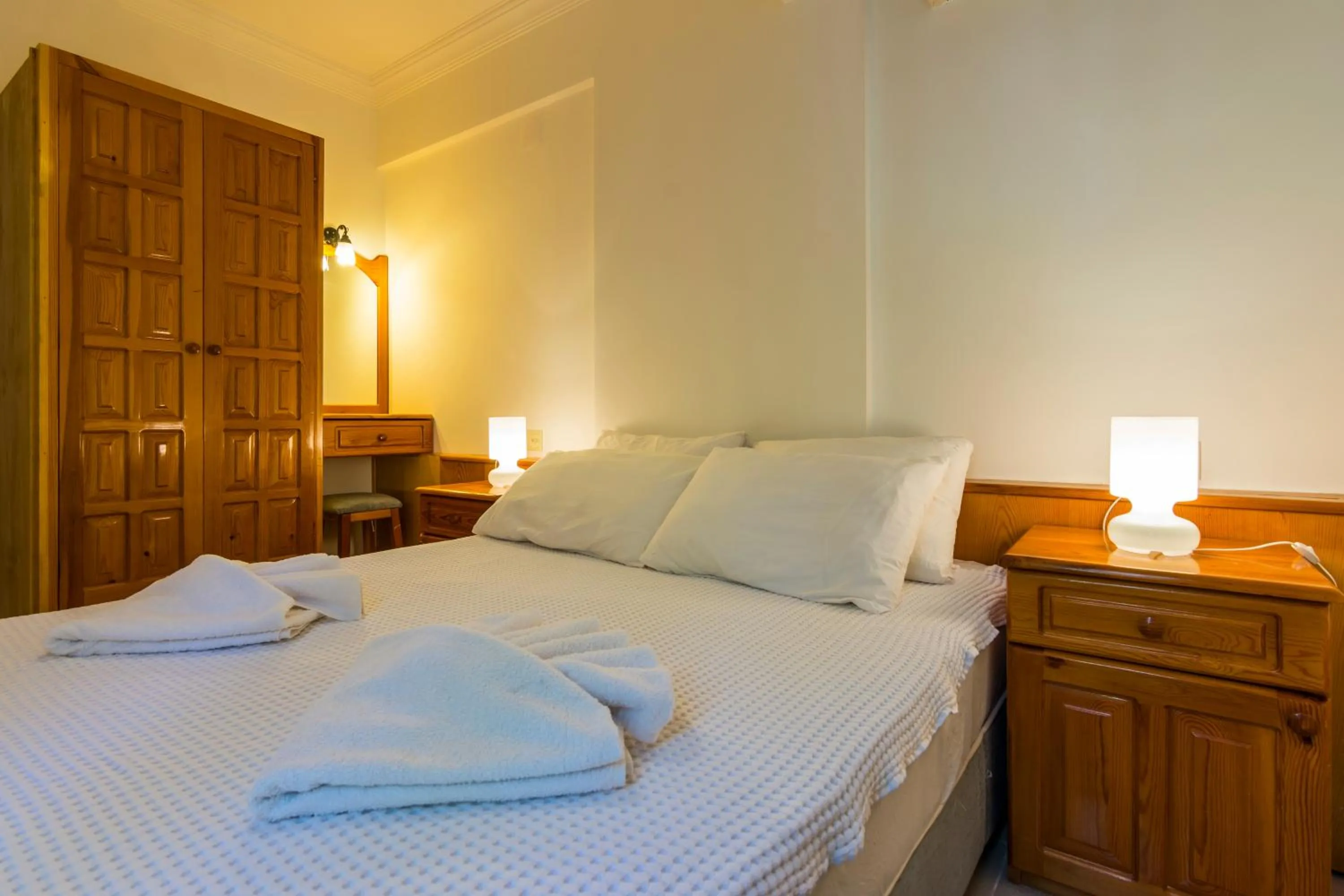 Bed in Calypso Cozy Suites