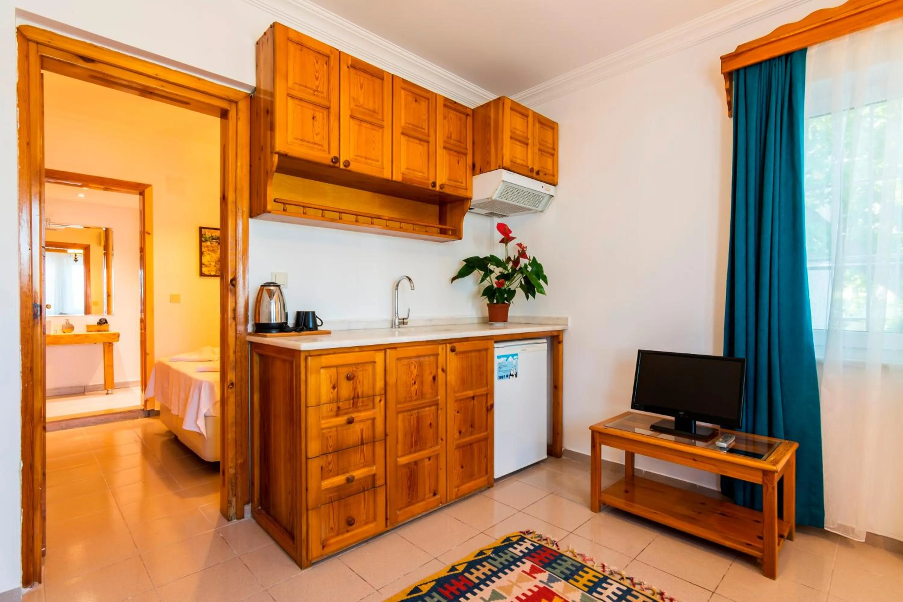 Bed in Calypso Cozy Suites