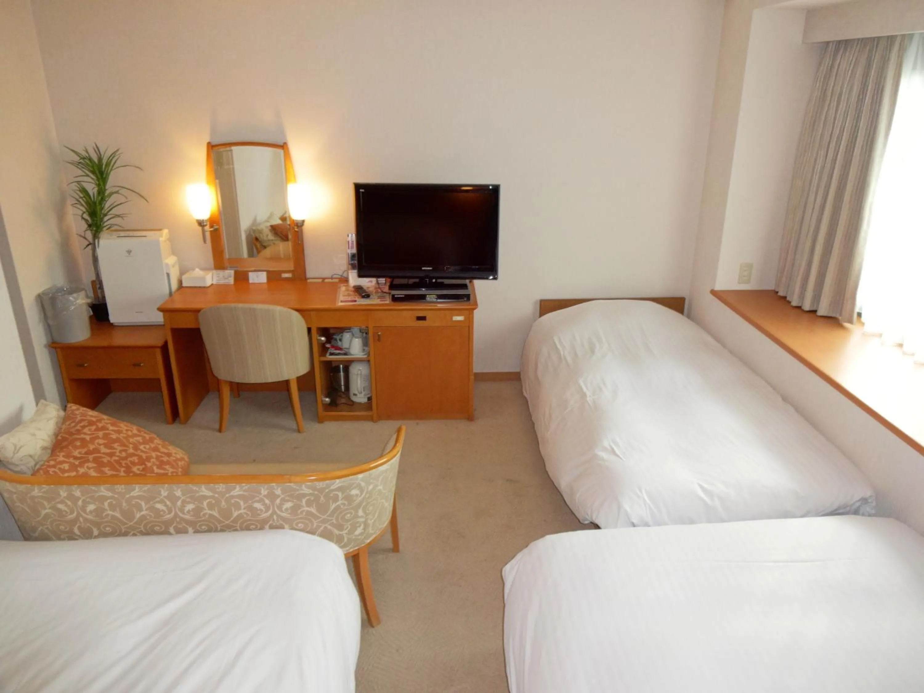 Bed in Kobe Luminous Hotel