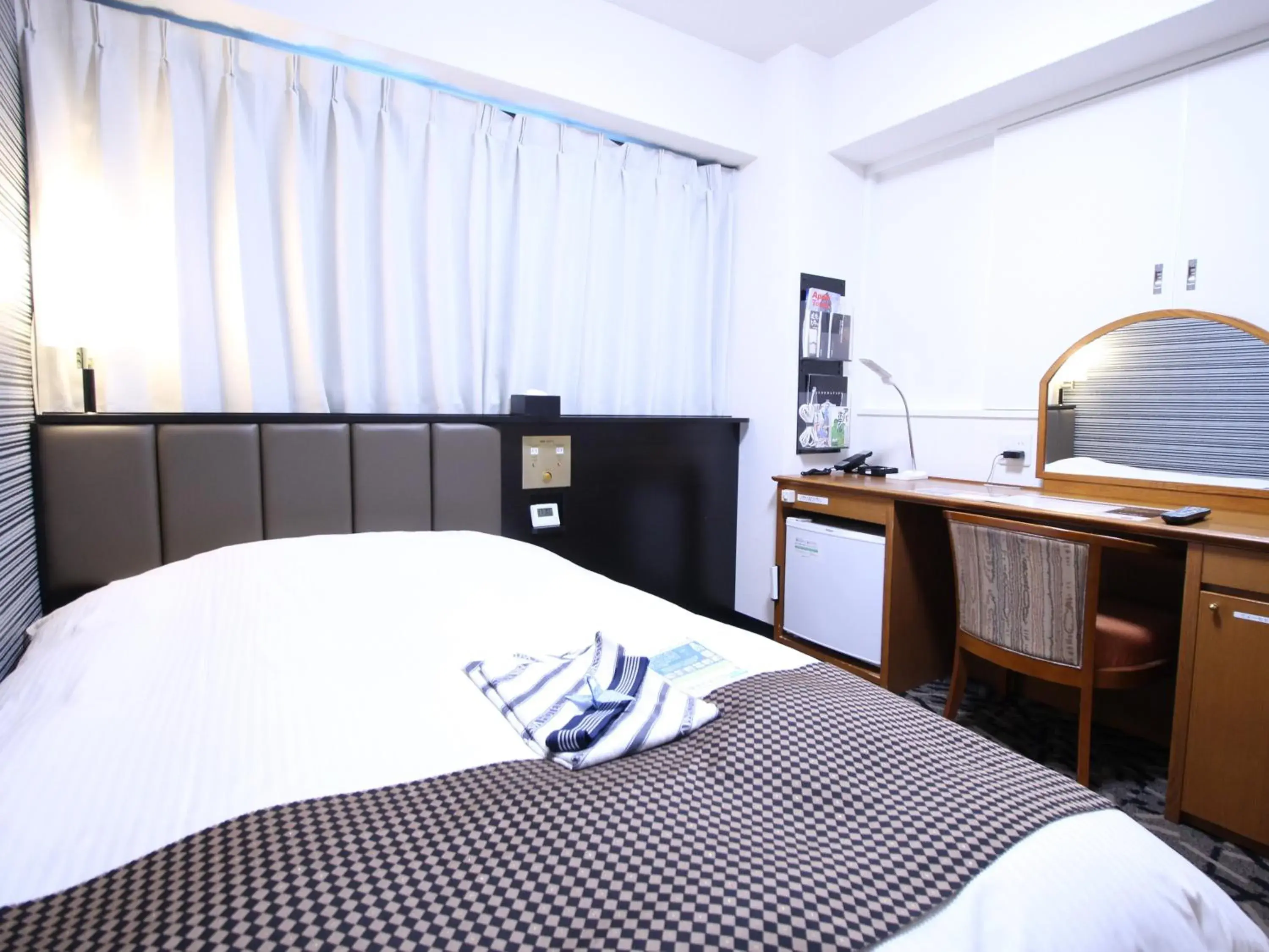 Bed in APA Hotel Hikoneminami Bed in APA Hotel Hikoneminami