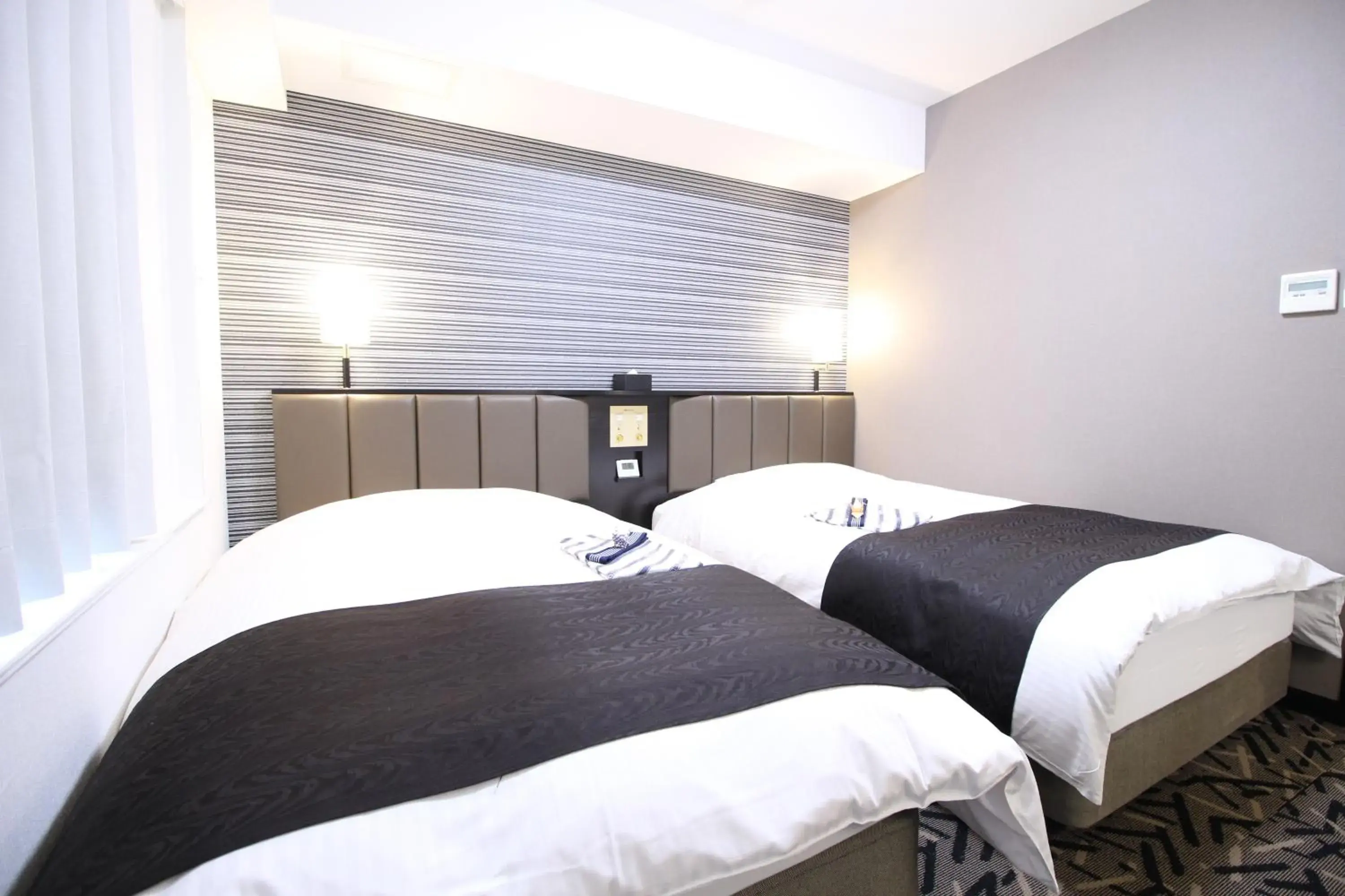 Bed in APA Hotel Hikoneminami Bed in APA Hotel Hikoneminami