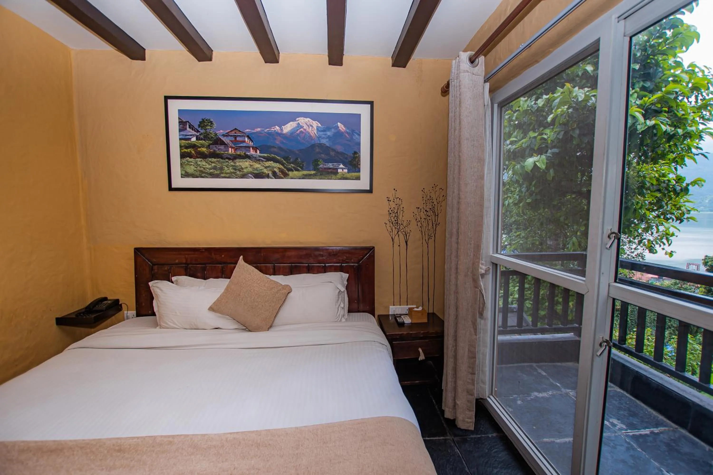 View (from property/room), Bed in Pokhara Boutique Hotel