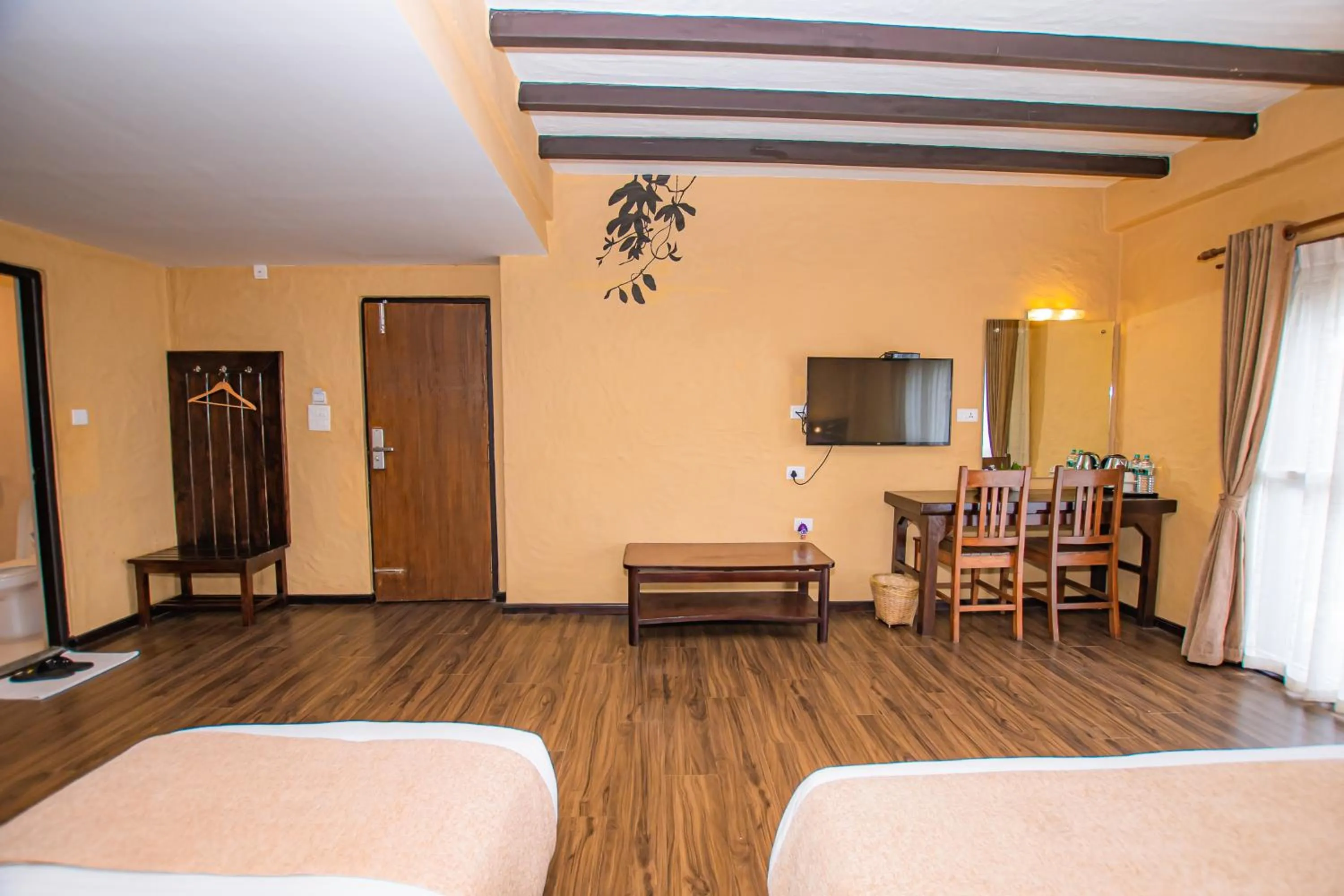 Photo of the whole room, Bed in Pokhara Boutique Hotel