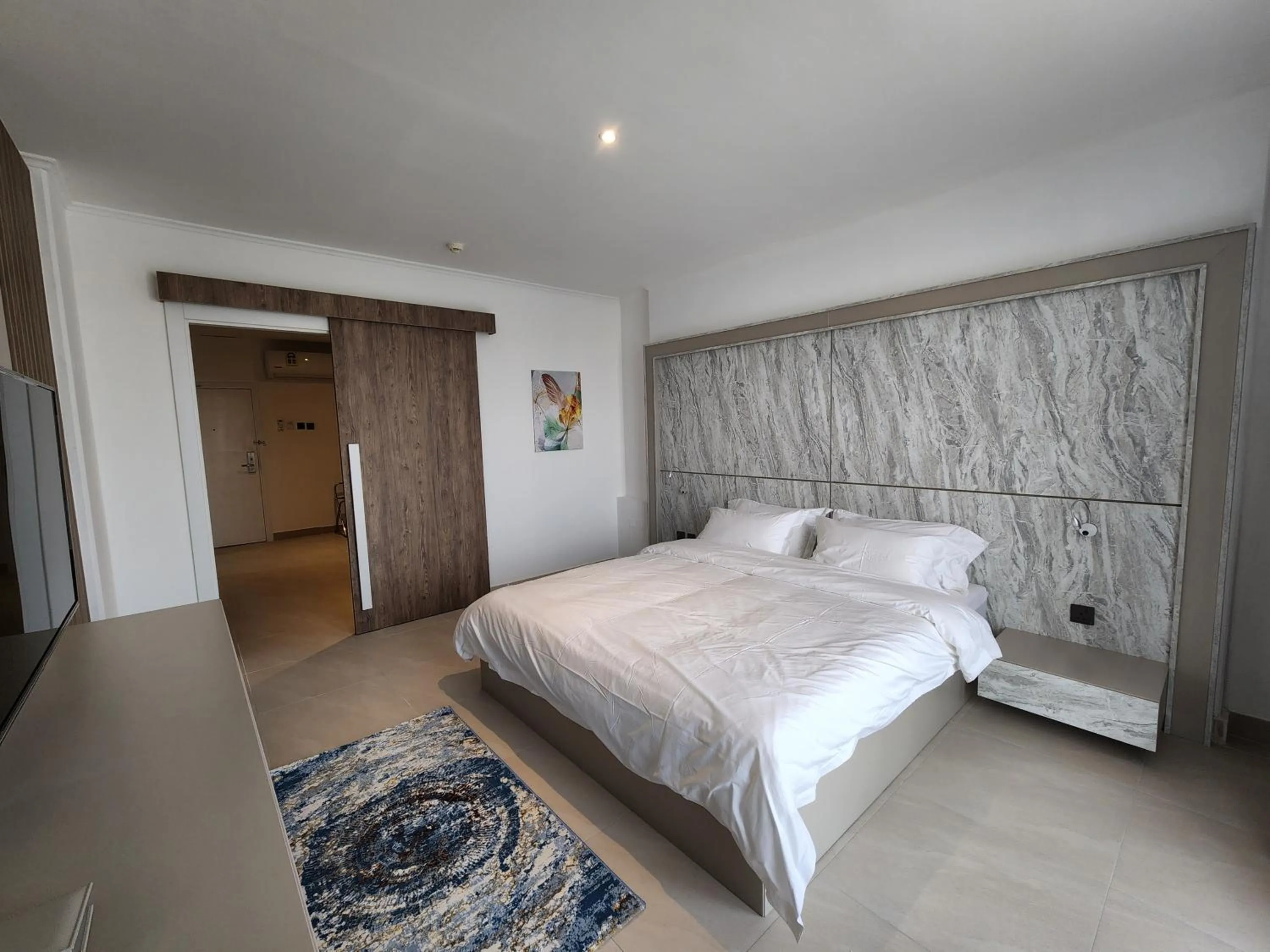 Bed in Imperial Suites Hotel