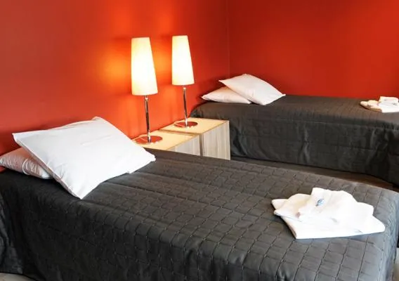 Photo of the whole room, Bed in Finlandia Hotel Lumiainen