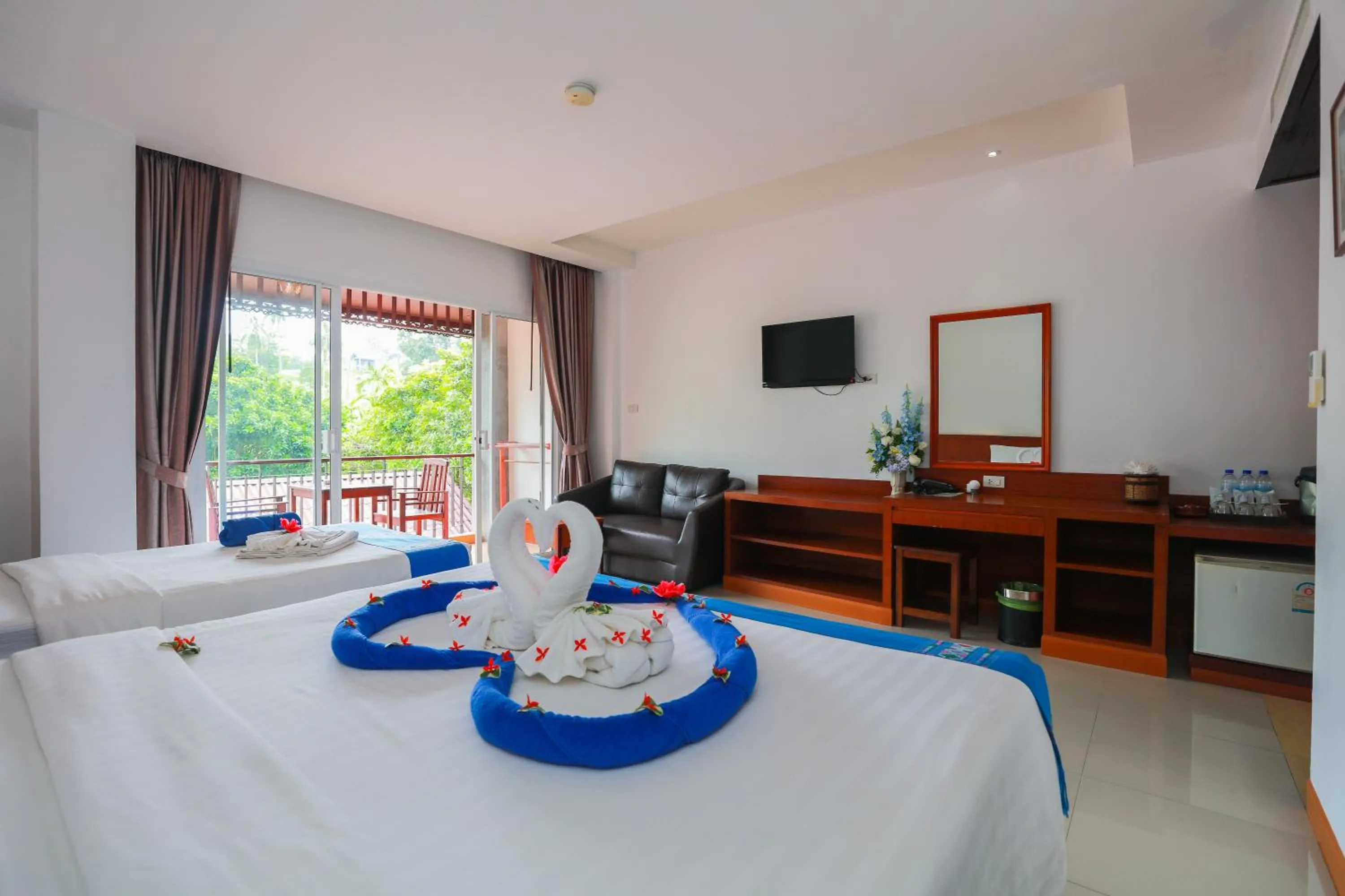 Bed in Baan Vanida Garden Resort