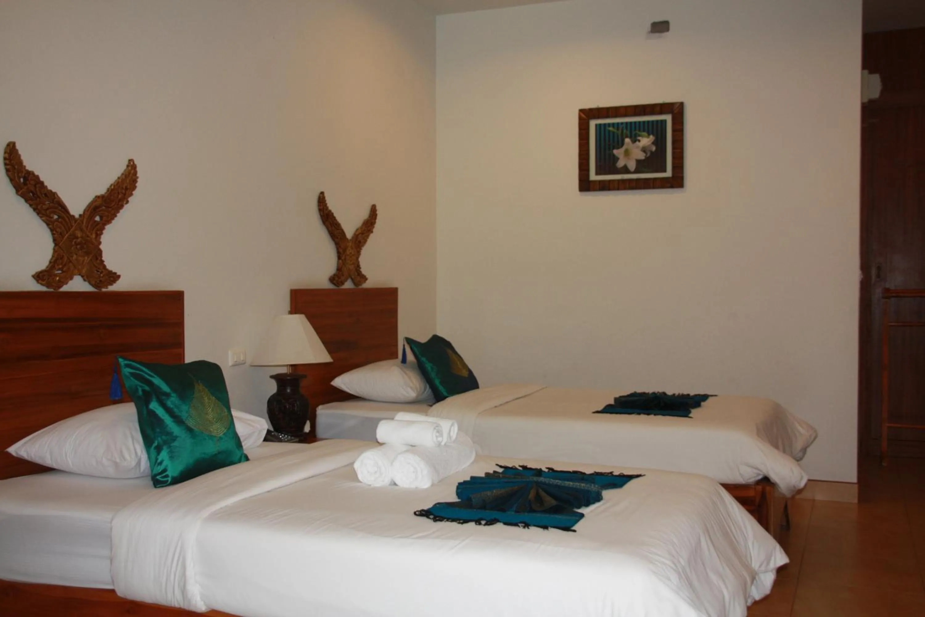 Bed in Baan Vanida Garden Resort