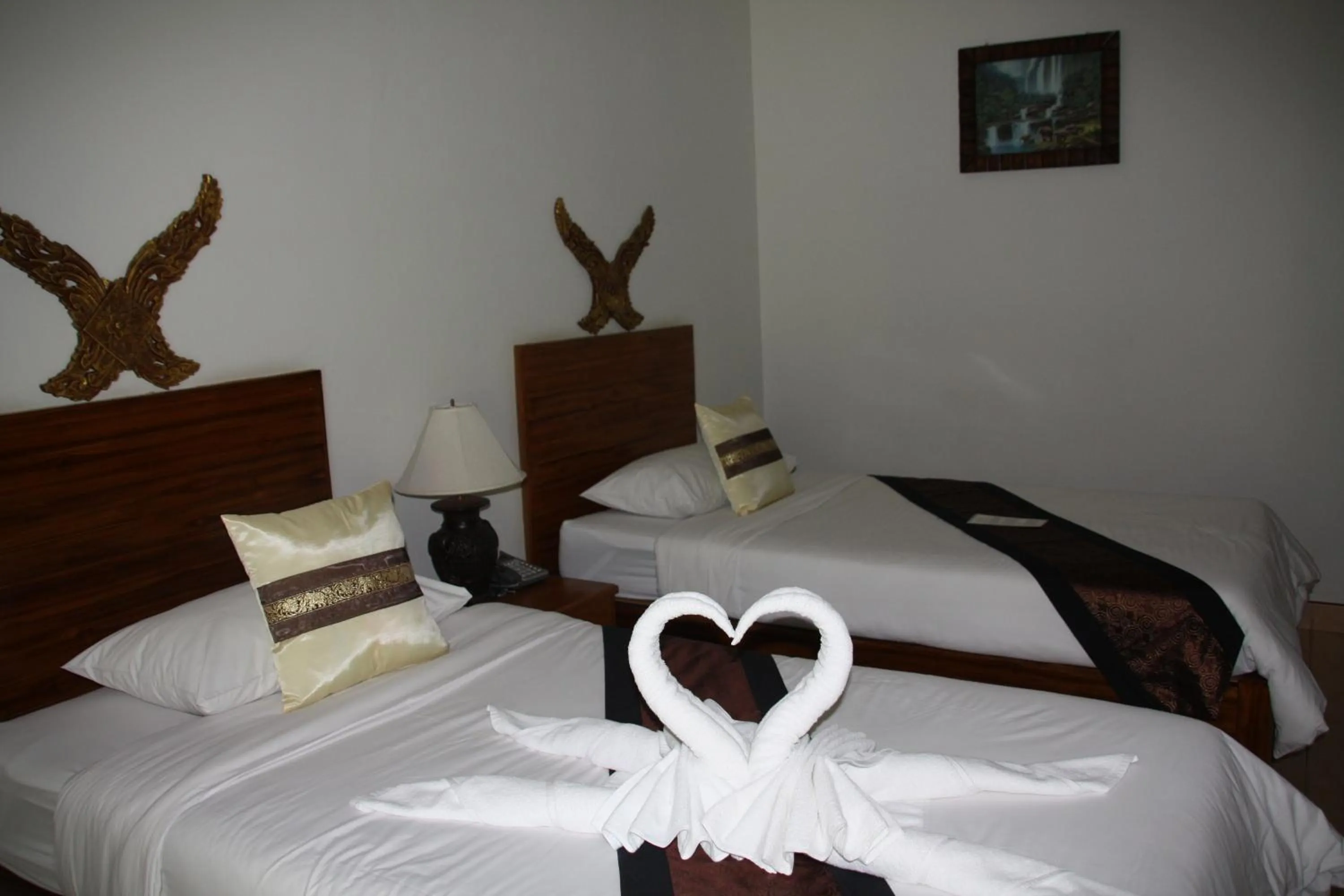 Bed in Baan Vanida Garden Resort