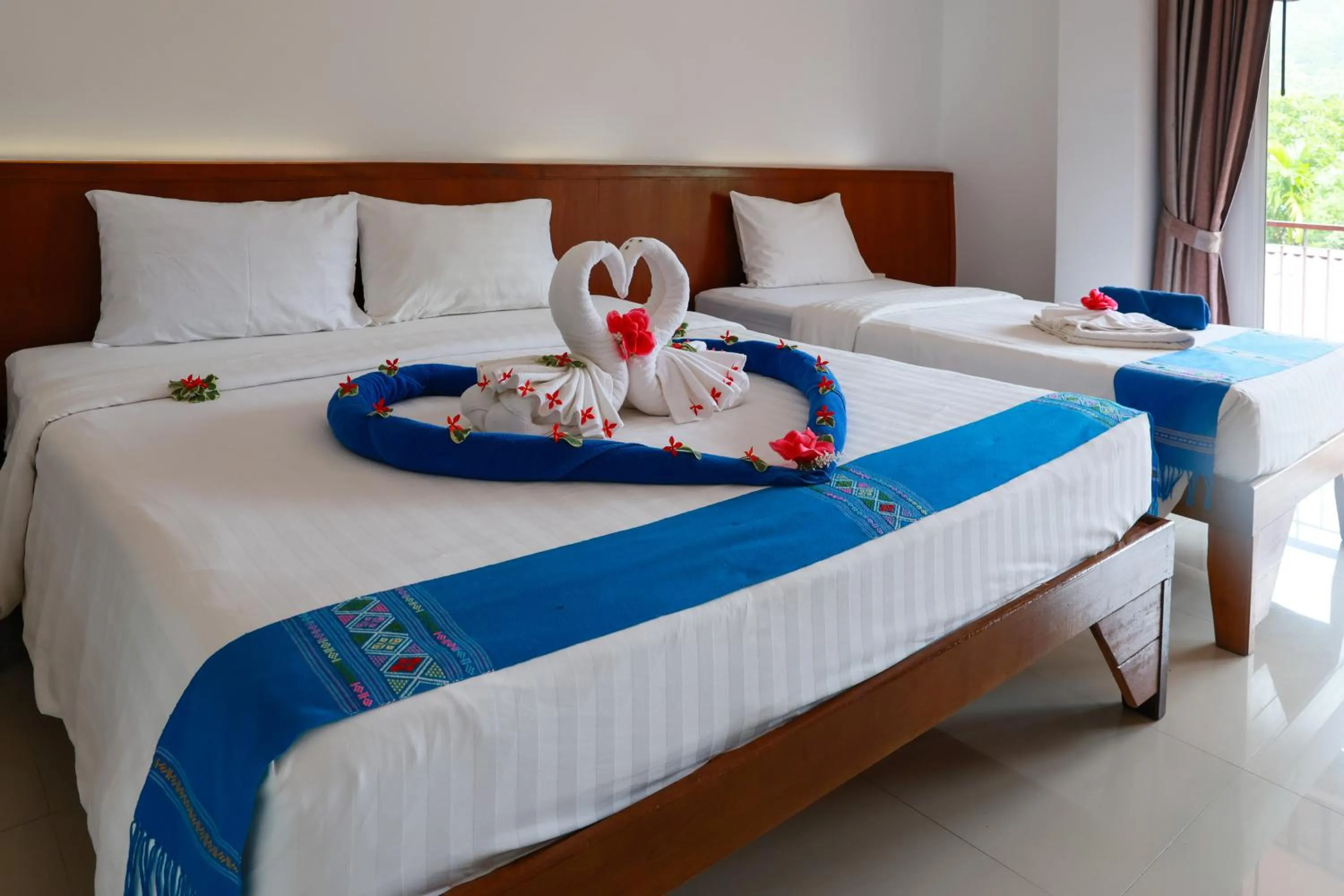 Bed in Baan Vanida Garden Resort