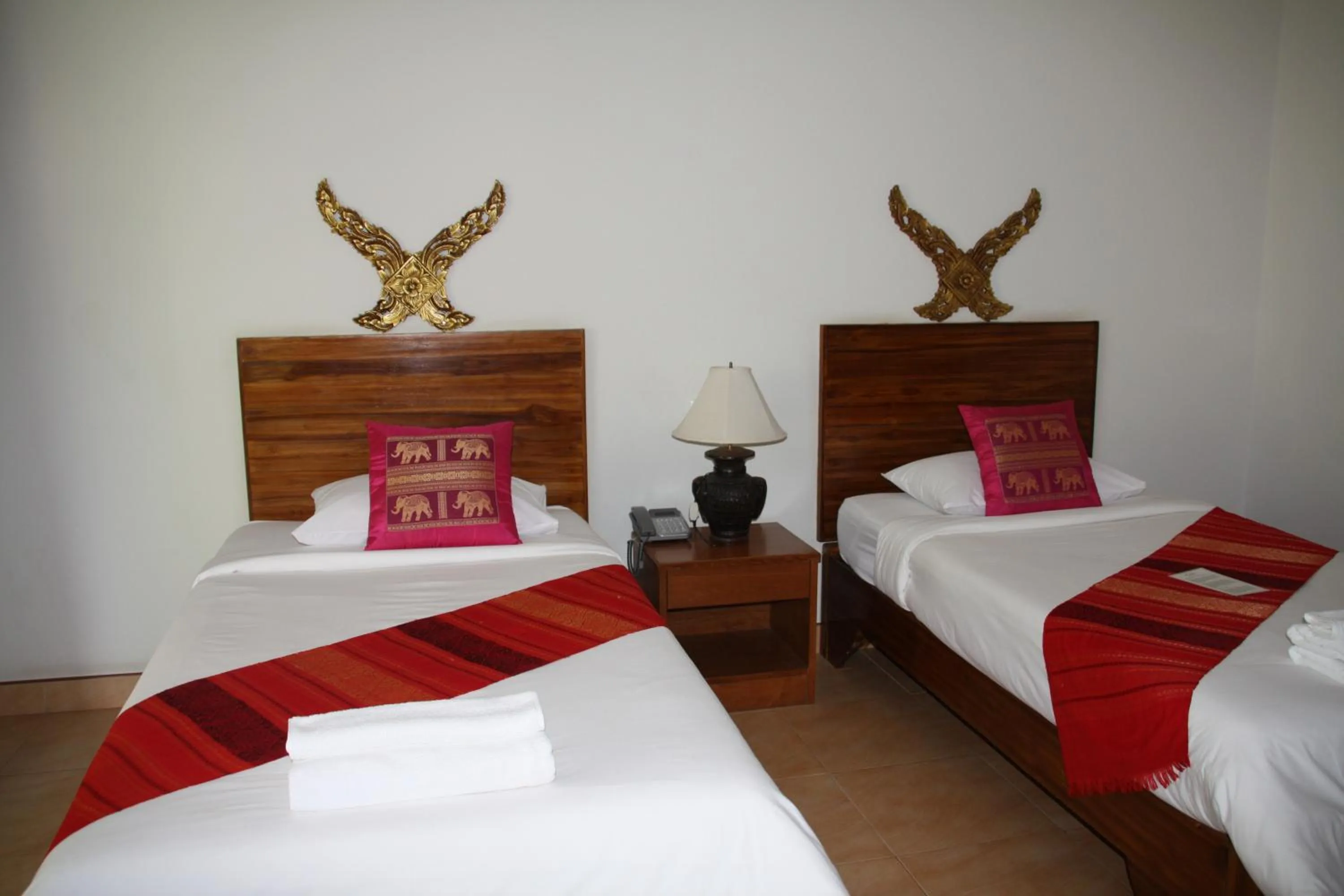 Bed in Baan Vanida Garden Resort