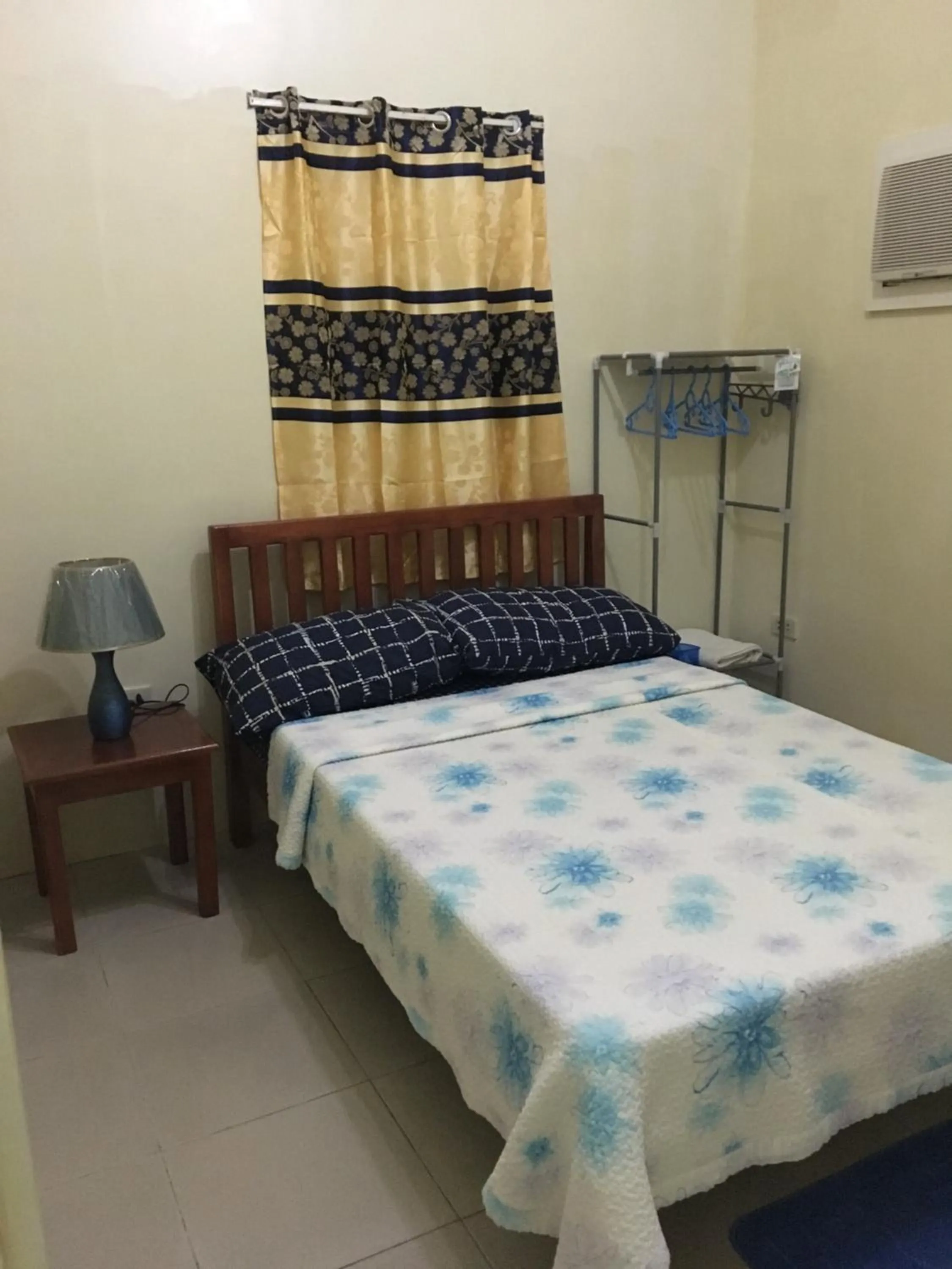 Bed in Blue Summer Suites & Restaurant