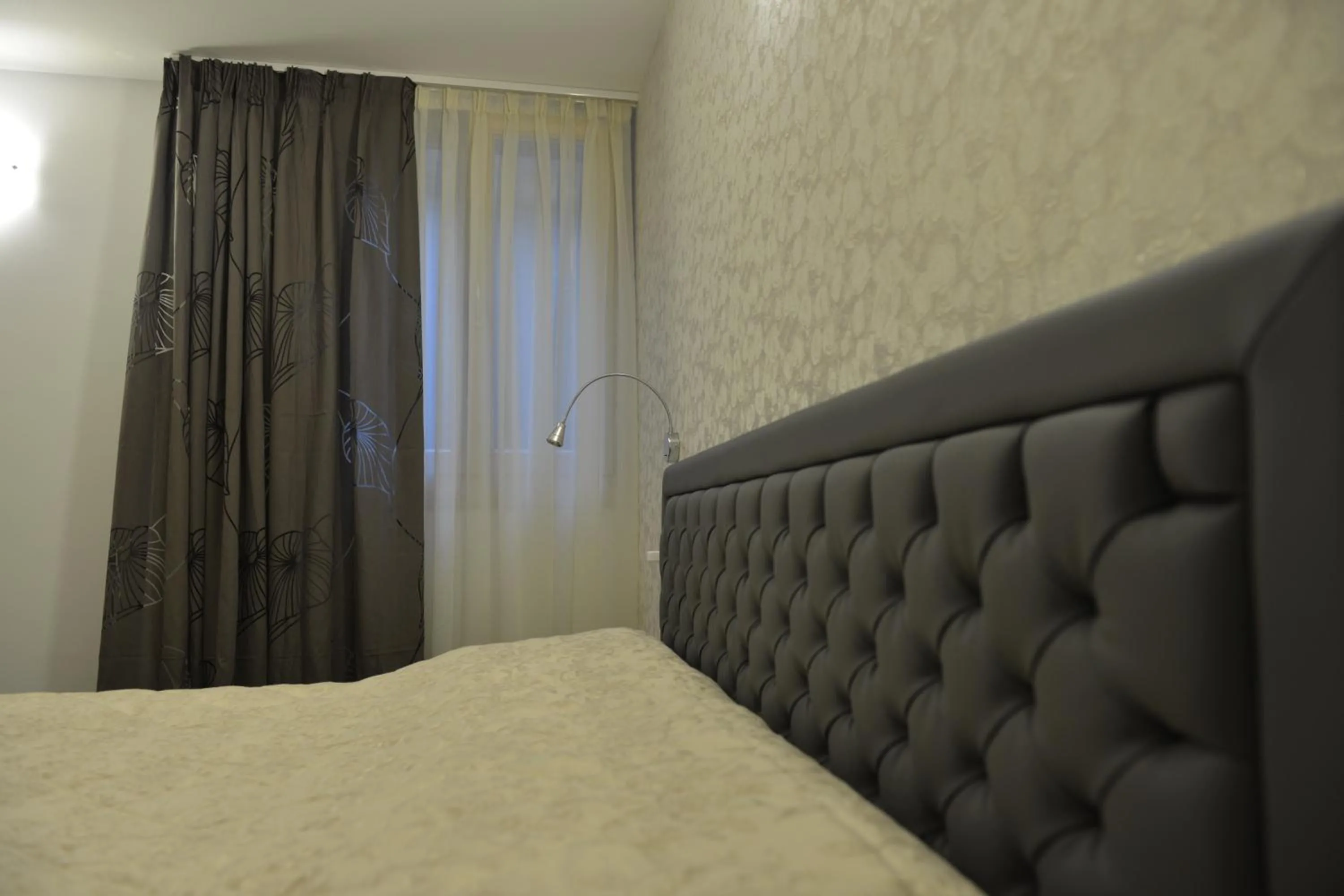 Bed in Sirmione Park View Luxury Apartments