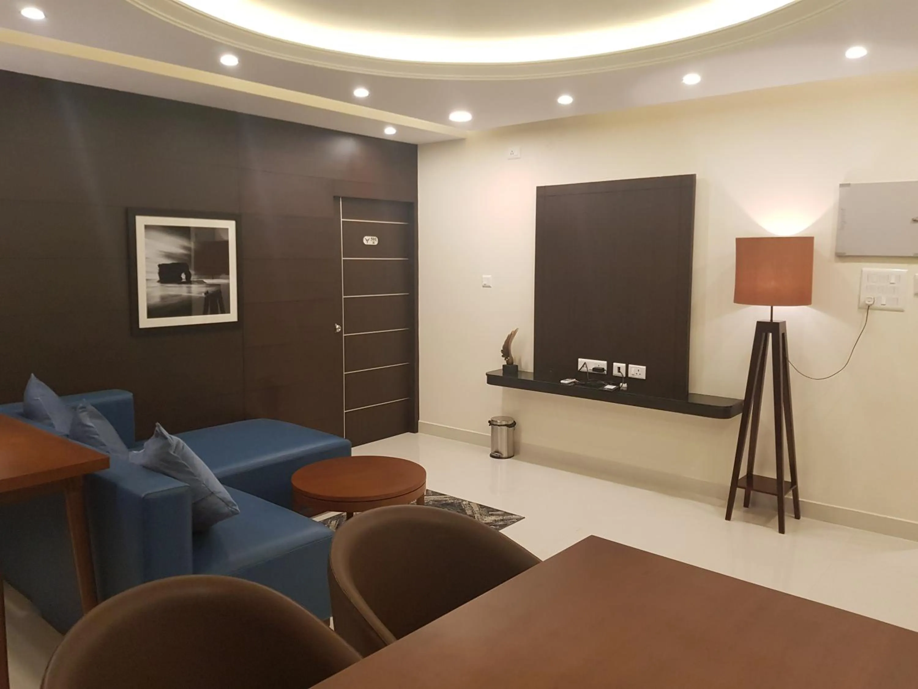 Communal lounge/ TV room in The Bull Boutique Hotel