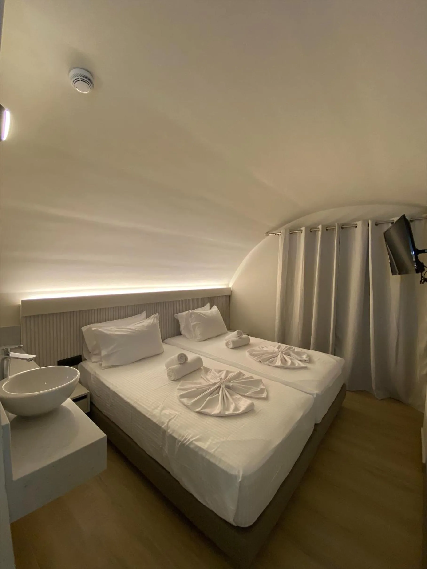 Bed in Barbie Hotel Apartments