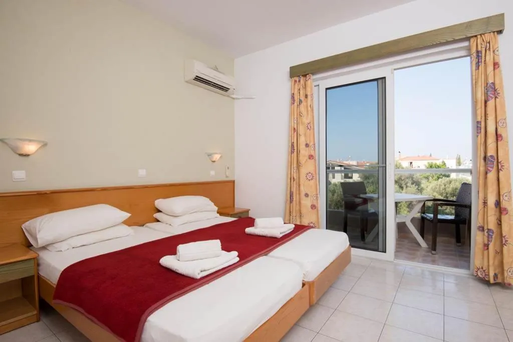 Bed in Barbie Hotel Apartments