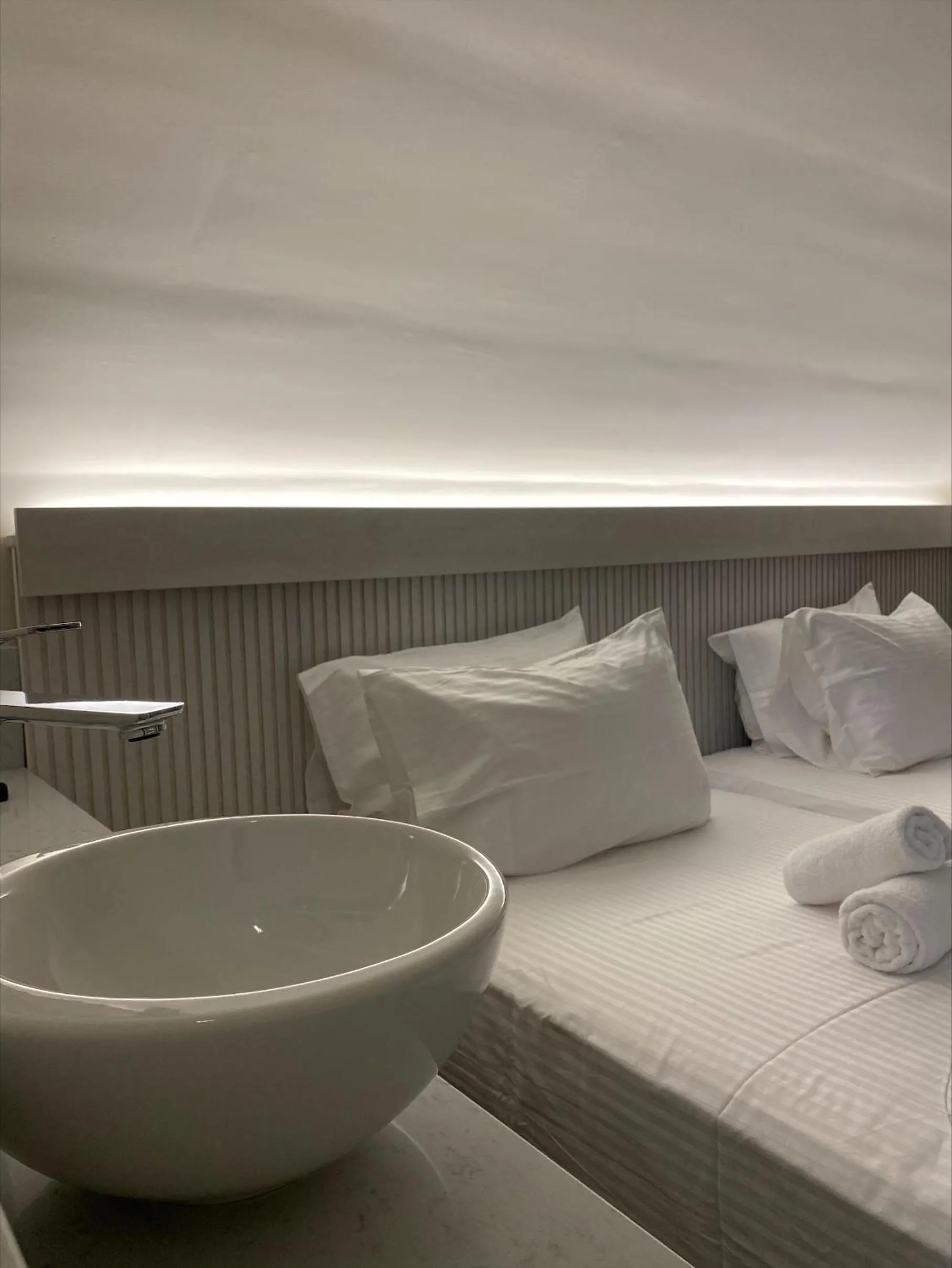 Bed in Barbie Hotel Apartments