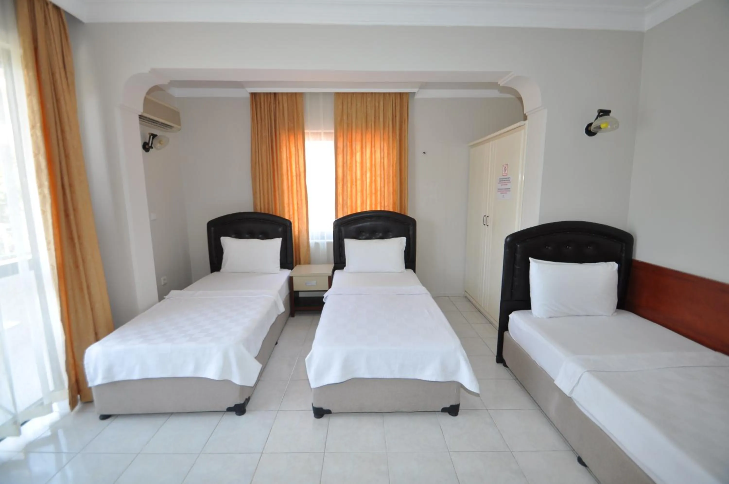 Bed in Defne & Zevkim Hotel