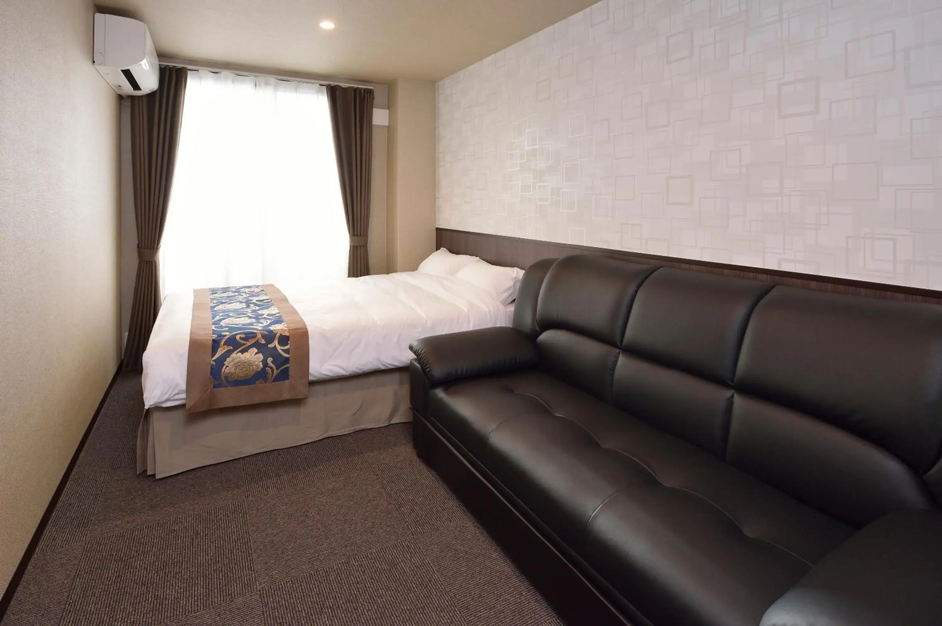 Seating area, Bed in UU Inn Kyoto Seating area, Bed in UU Inn Kyoto