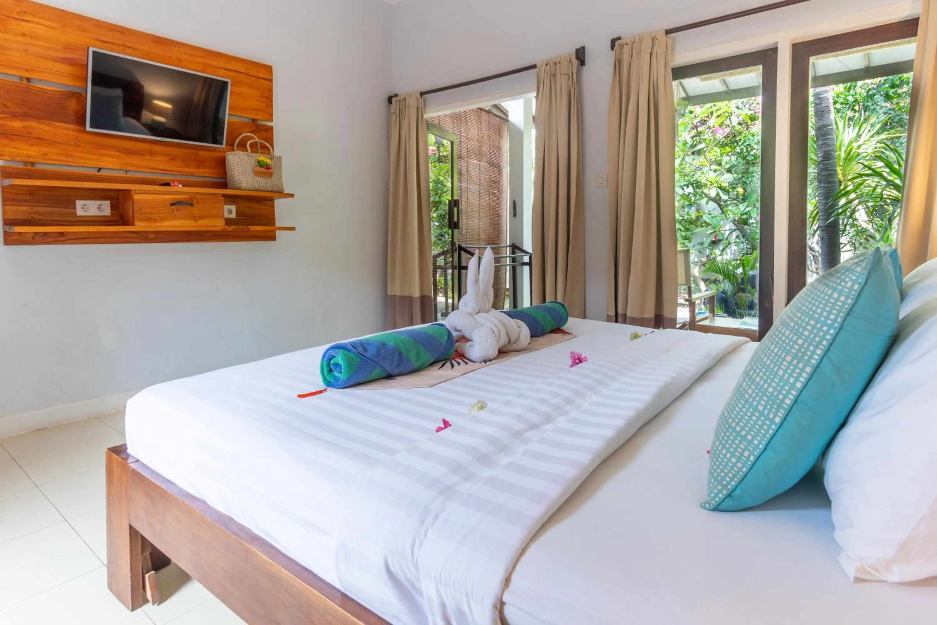 Bed in Bale Sampan Boutique Bungalows