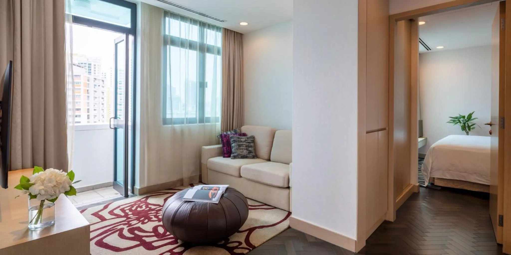 Living room, Bed in Fraser Suites Singapore