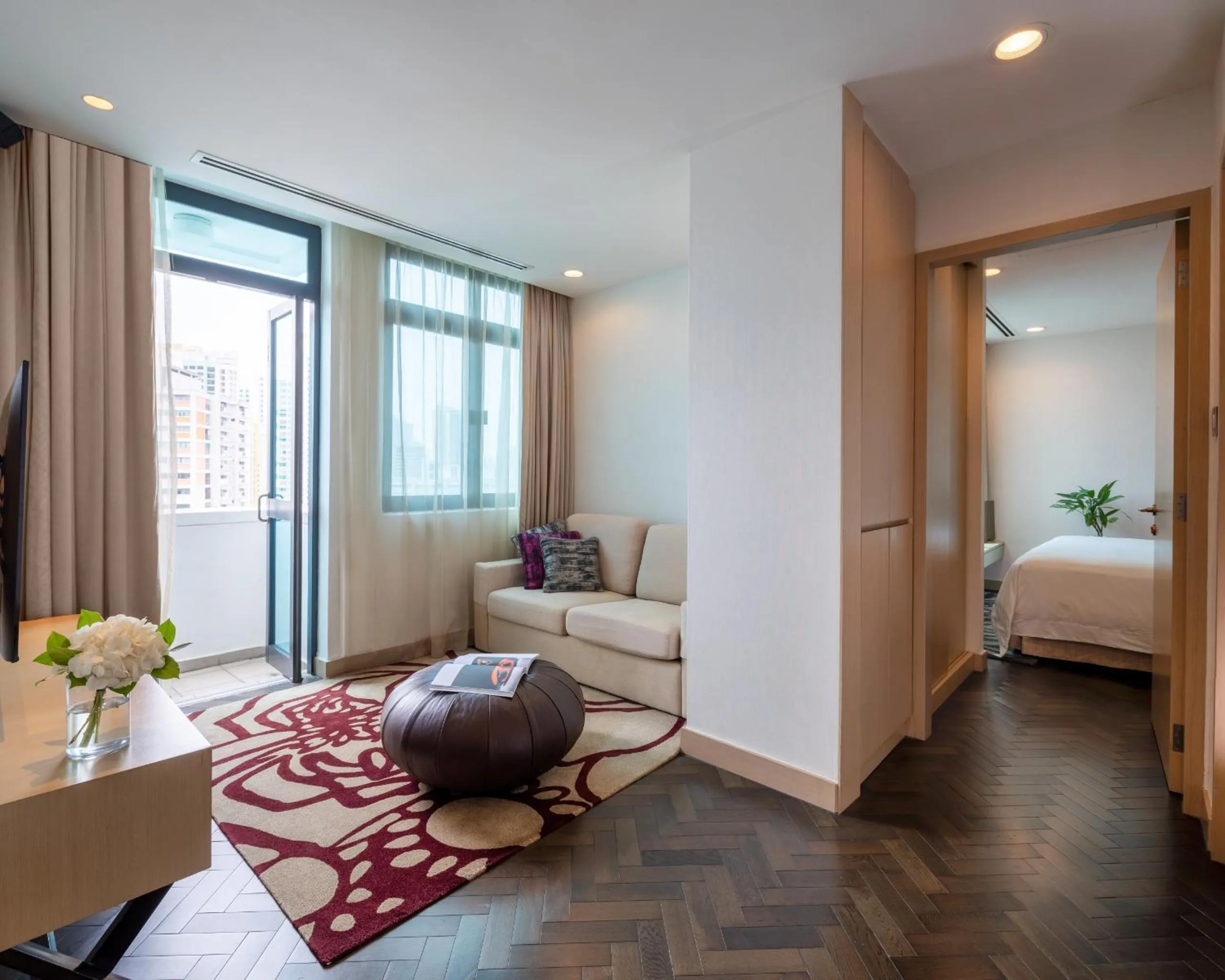 Living room, Bed in Fraser Suites Singapore
