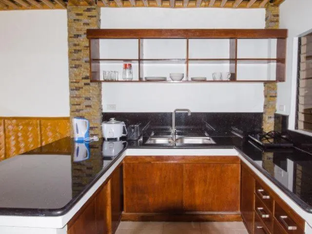 Kitchen or kitchenette in Villa de Pico Highland Beach Resort