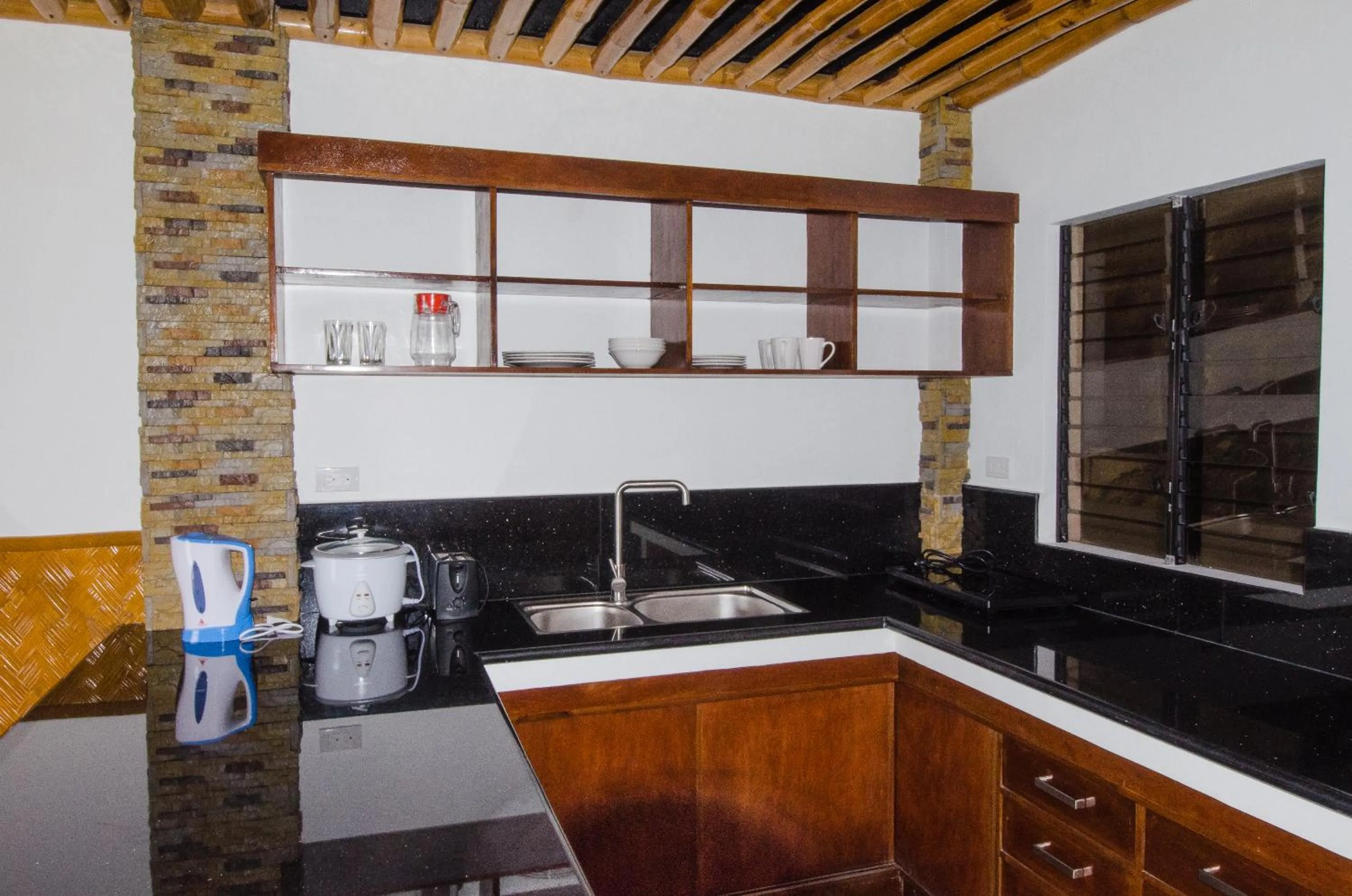 Kitchen or kitchenette in Villa de Pico Highland Beach Resort