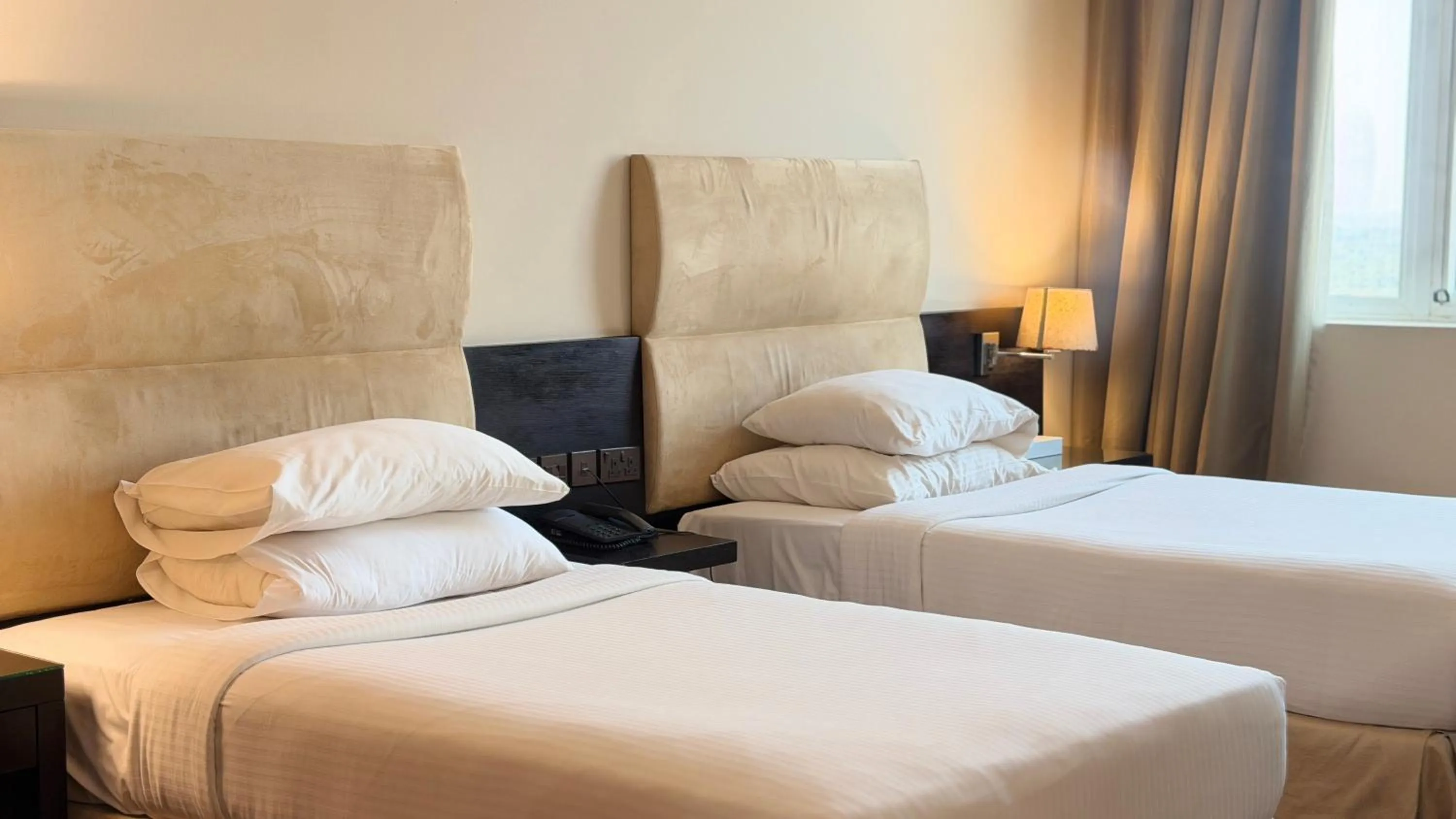 Bed in Sunday Mangrove Corniche Hotel, Ras Al Khaimah