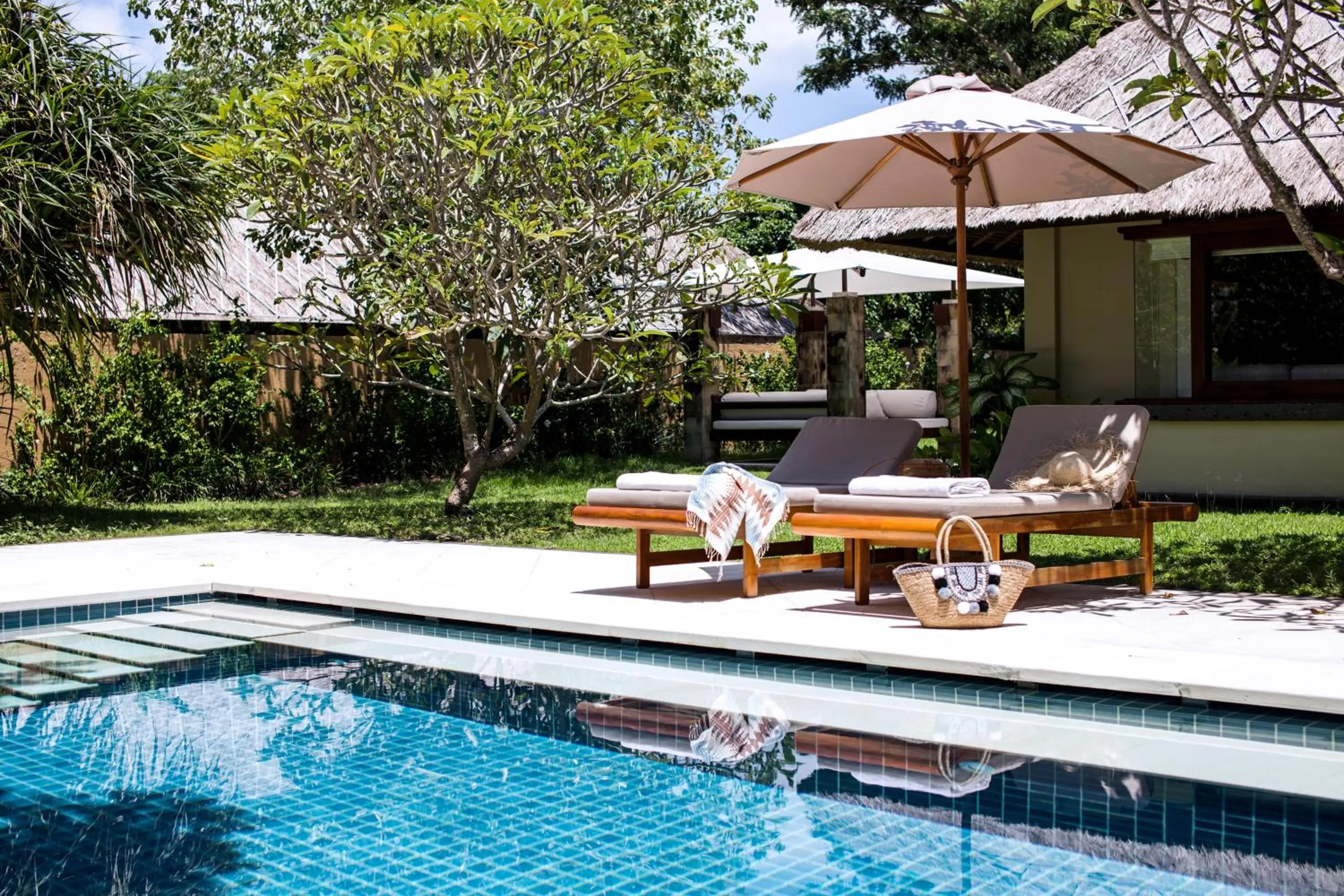 Swimming pool in REVĪVŌ Wellness Resort Nusa Dua Bali