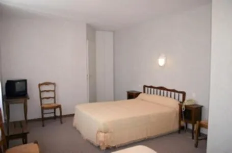 Photo of the whole room, Bed in Hôtel du Marché