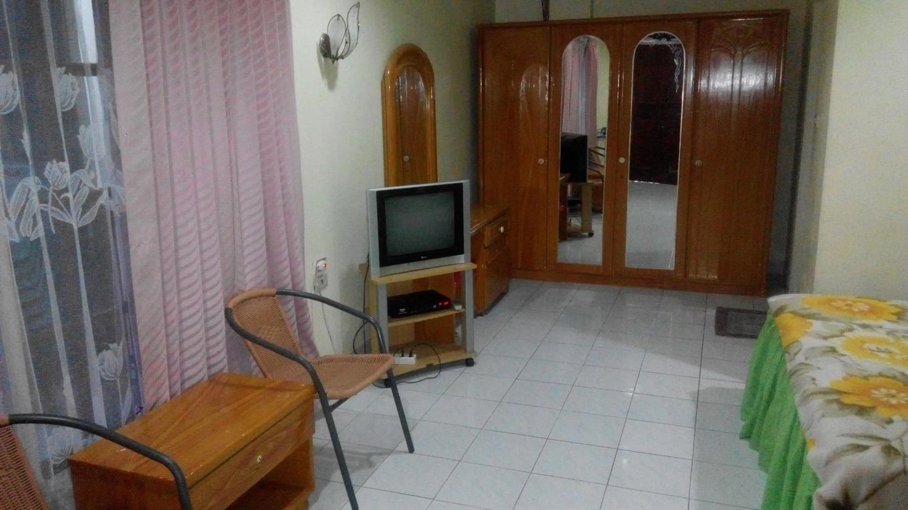 Communal lounge/ TV room in Melissa Palace Hotel and Karaoke