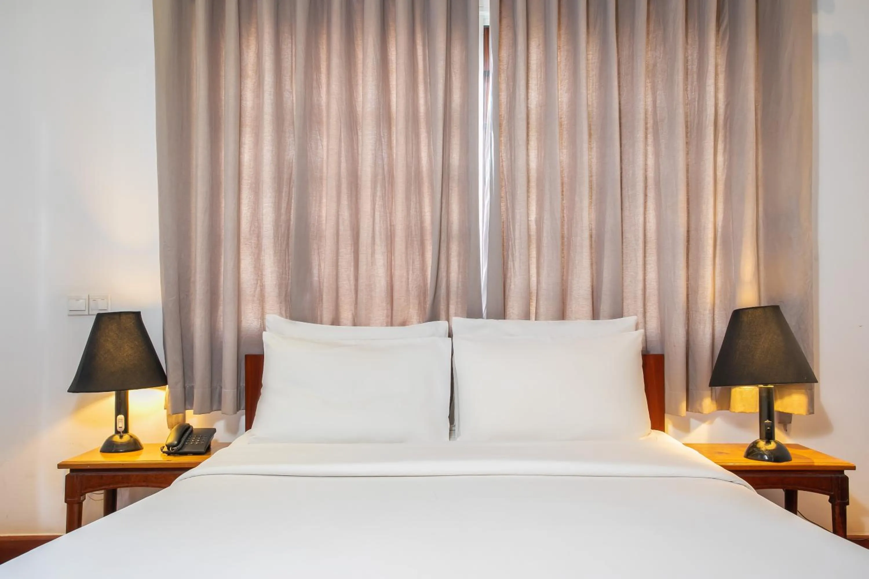 Bed in Apsara Centrepole Hotel