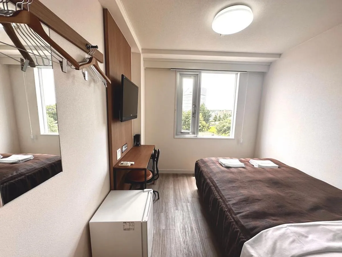 Bed in Tabist Tsukuba Sky Hotel