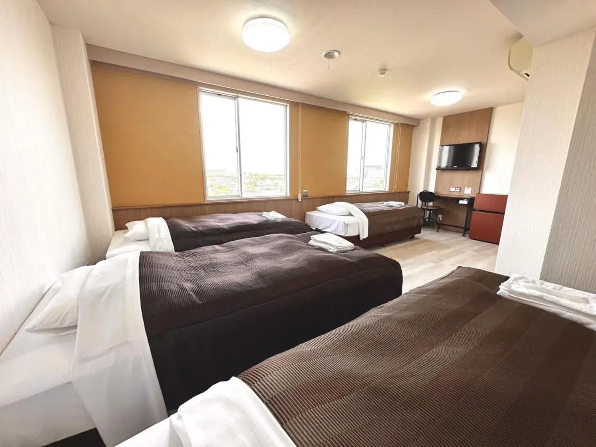 Bed in Tabist Tsukuba Sky Hotel Bed in Tabist Tsukuba Sky Hotel