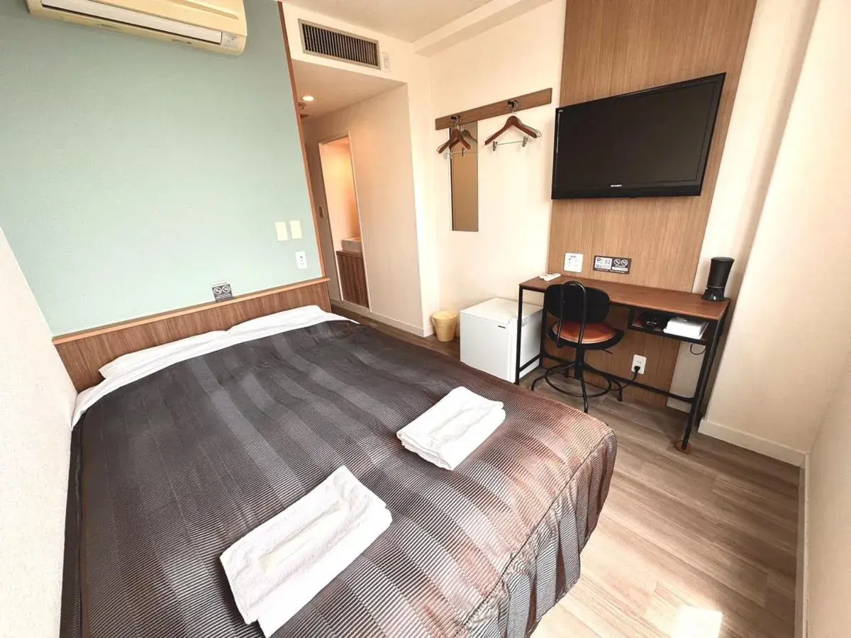 Bed in Tabist Tsukuba Sky Hotel Bed in Tabist Tsukuba Sky Hotel