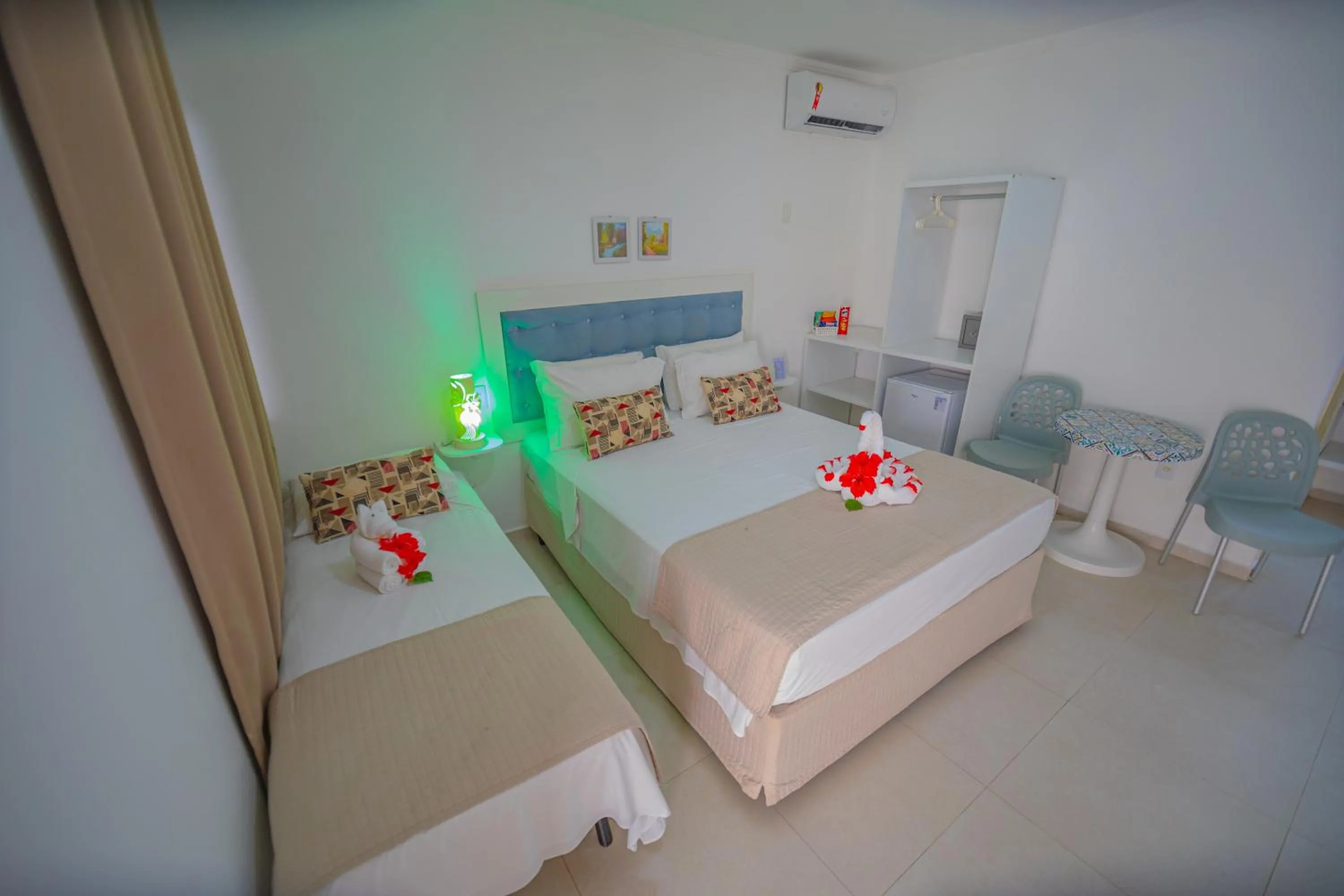 Bed in Pousada Polymar