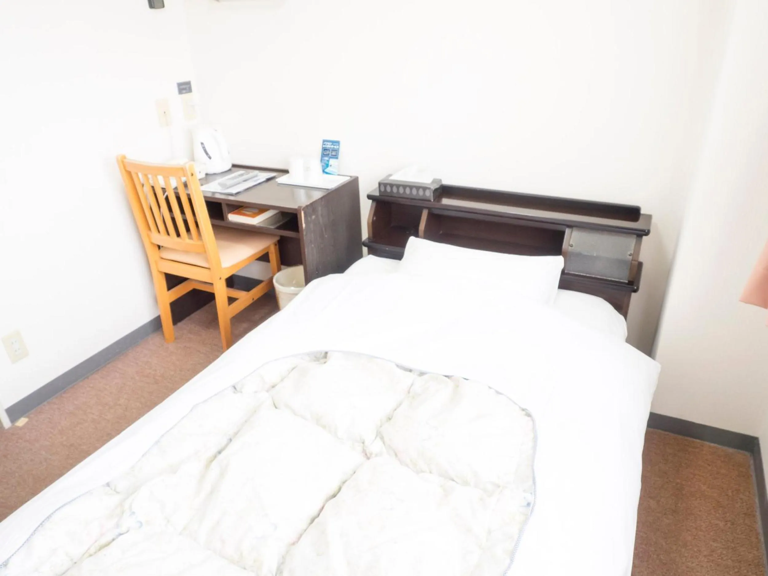 Bed in Hikone Station Hotel